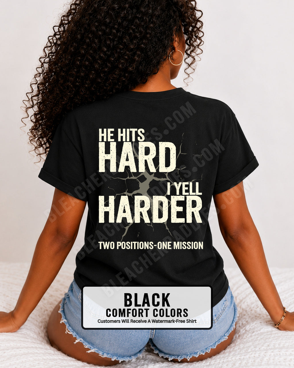 Back view of a black Comfort Colors t-shirt featuring the distressed "He Hits Hard I Yell Harder" football design with "Two Positions One Mission" printed across the lower back. Football mom shirt.