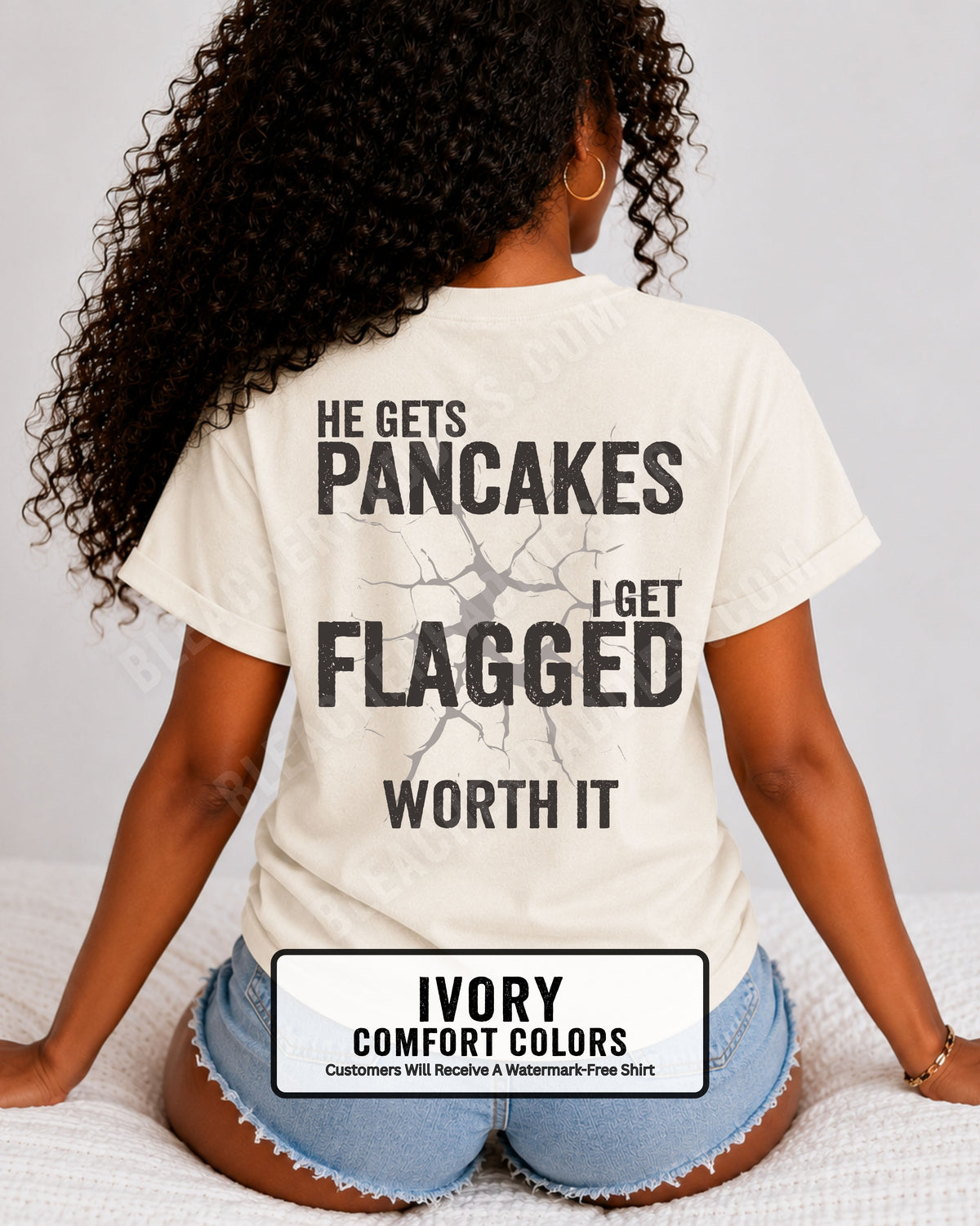 Football mom game day comfort colors t- shirt in ivory with back design that reads “He gets pancakes I get flagged worth it” in distressed black text with cracked graphic