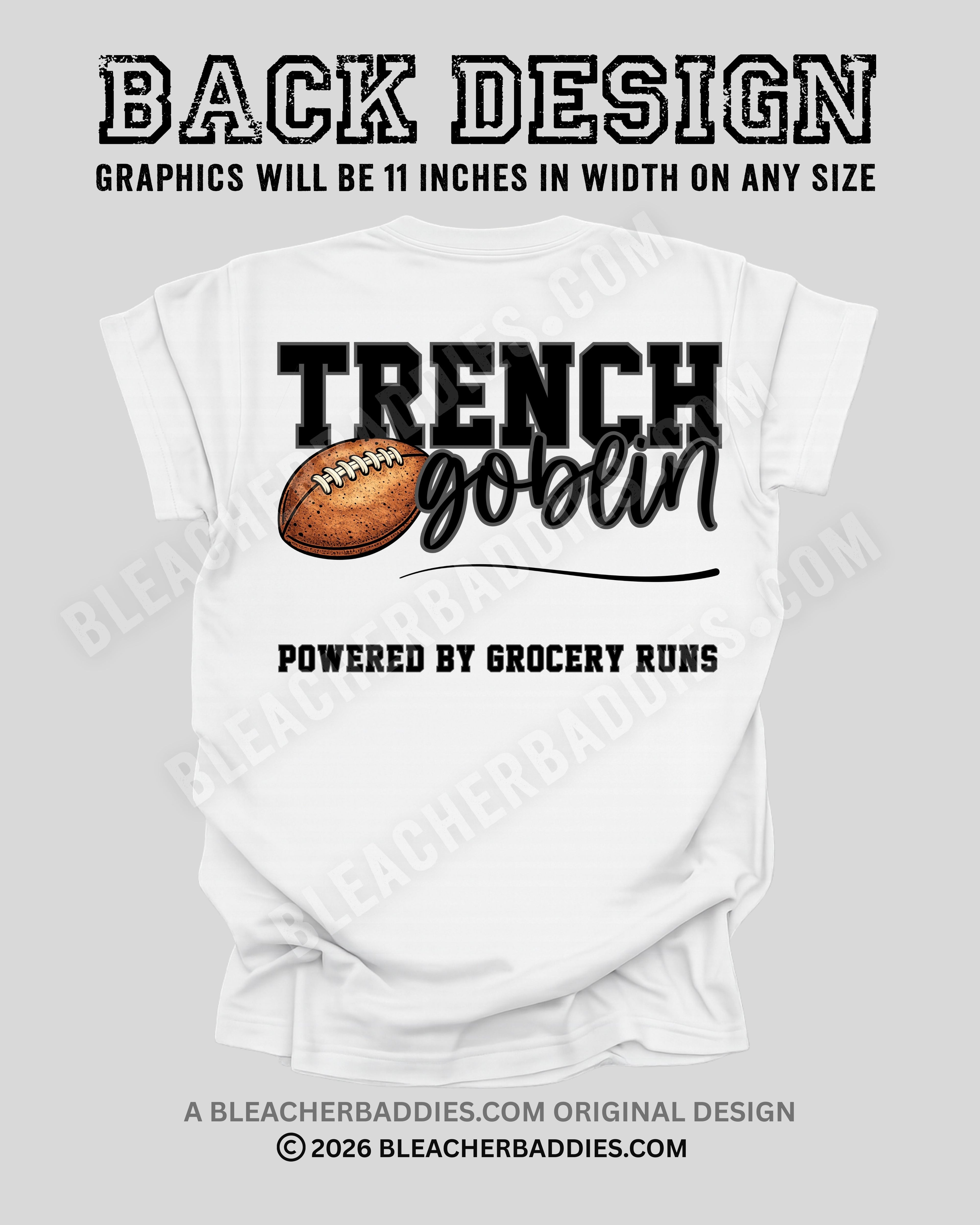 Back of white football mom game day shirt showing “Trench Goblin” football graphic with the phrase “Powered by Grocery Runs.” Graphic width displayed as 11 inches.