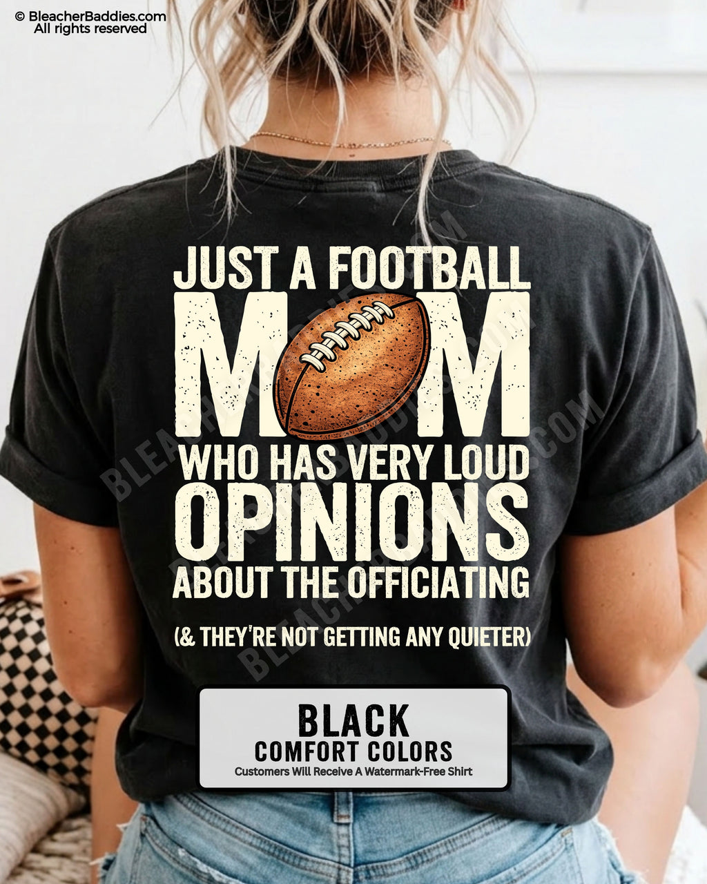 Football mom game day shirt worn by a model on a black Comfort Colors tee, featuring a back graphic that says, “Just a football mom who has very loud opinions about the officiating (& they’re not getting any quieter).”