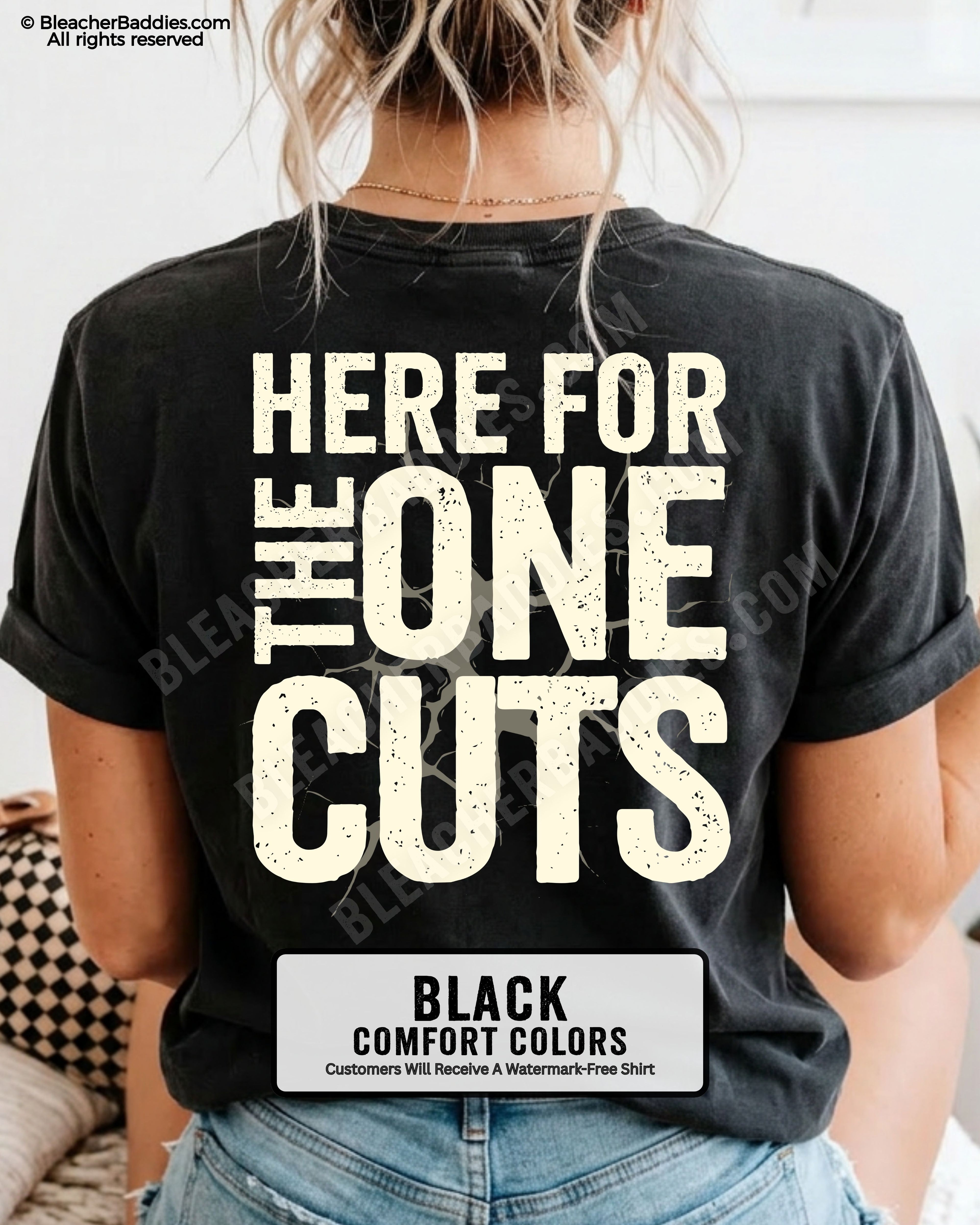 close-up back view of black comfort colors football mom game day shirt with “here for the one cuts” design printed on the back