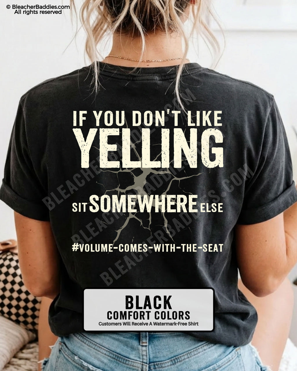 Woman wearing a black Comfort Colors t-shirt shown from the back featuring a large distressed cream graphic that reads “If You Don’t Like Yelling Sit Somewhere Else #Volume Comes With the Seat.”