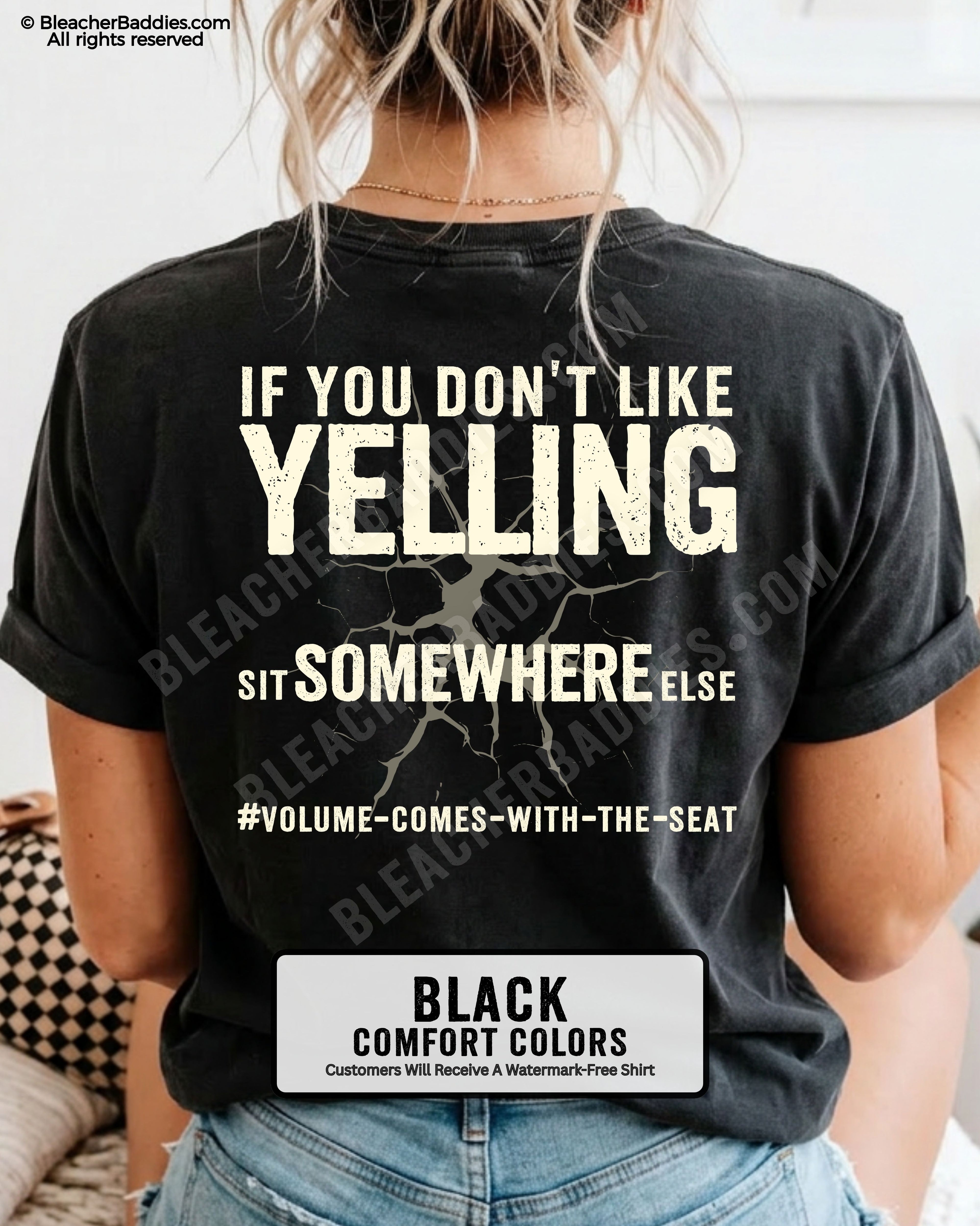 Woman wearing a black Comfort Colors t-shirt shown from the back featuring a large distressed cream graphic that reads “If You Don’t Like Yelling Sit Somewhere Else #Volume Comes With the Seat.”