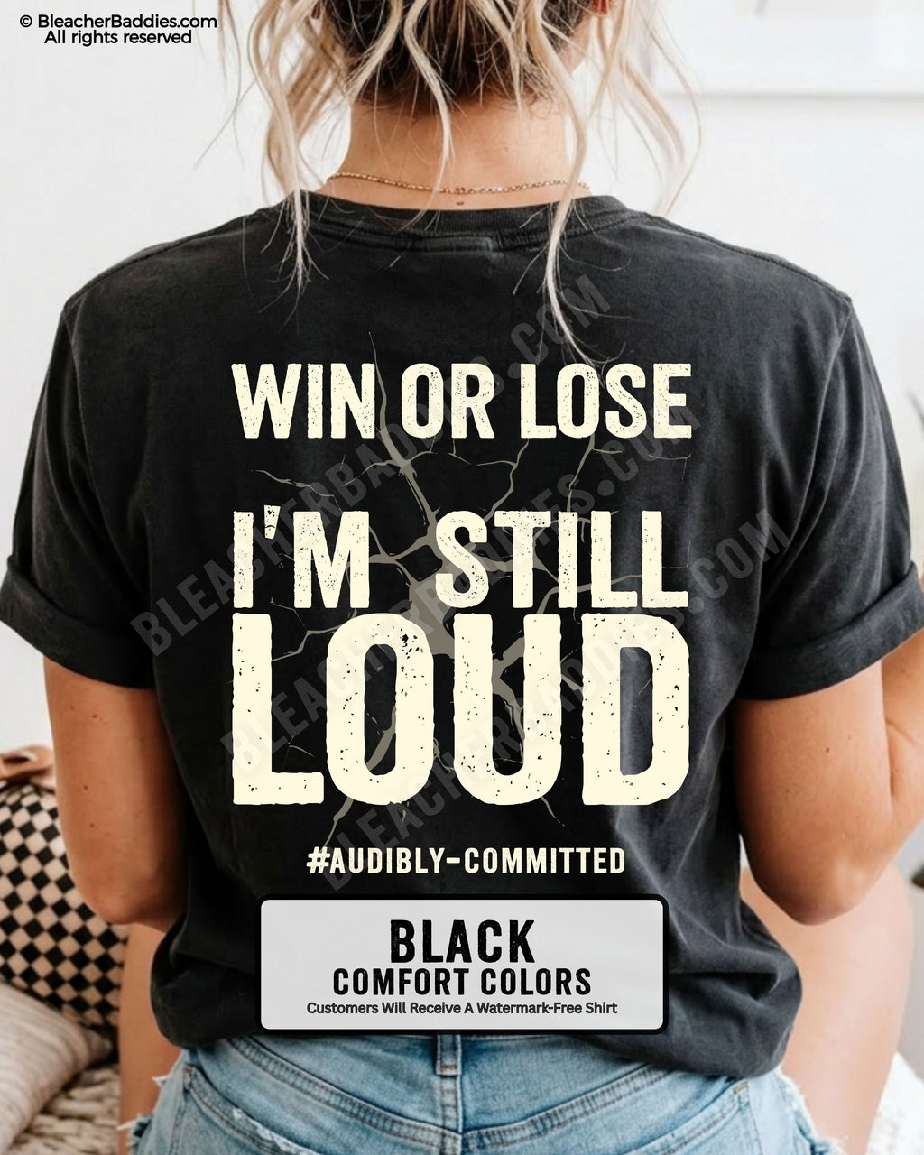 Woman wearing a black Comfort Colors t-shirt shown from the back featuring a large distressed cream graphic that reads “Win or Lose I’m Still Loud #Audibly Committed.”