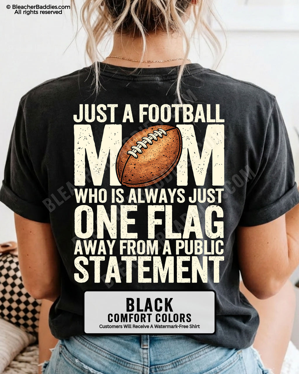 black comfort colors football mom game day shirt worn by model with back graphic that says just a football mom who is always just one flag away from a public statement