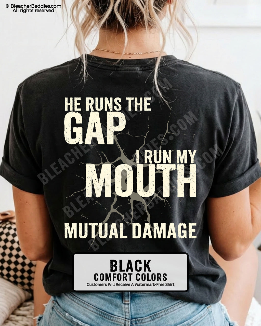 Back view of football mom wearing black Comfort Colors game day shirt with “He Runs the Gap I Run My Mouth Mutual Damage” graphic design