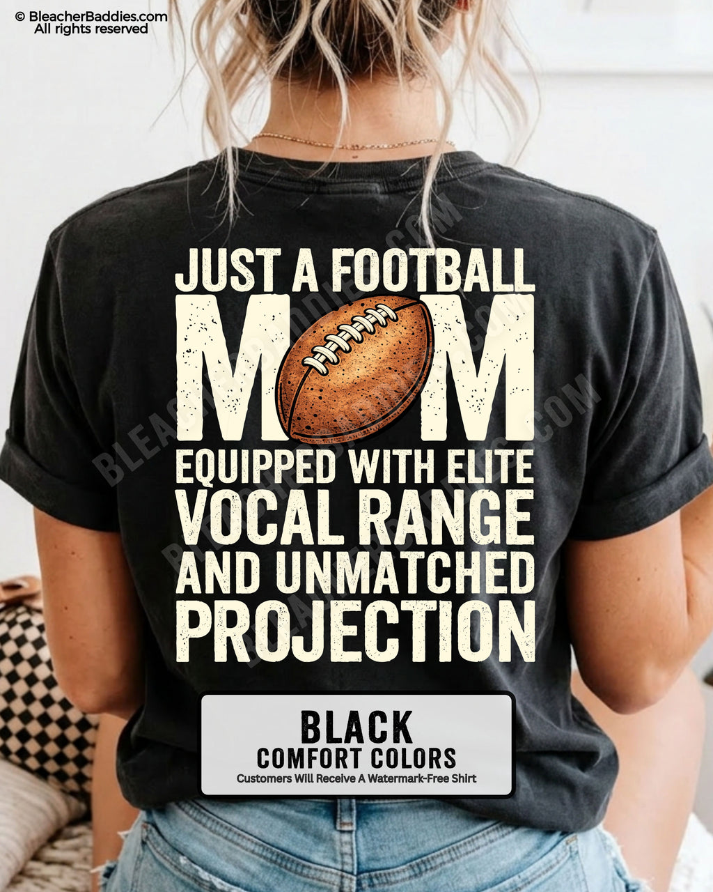Football mom game day shirt on a black Comfort Colors tee, featuring a back graphic that says, “Just a football mom equipped with elite vocal range and unmatched projection.”