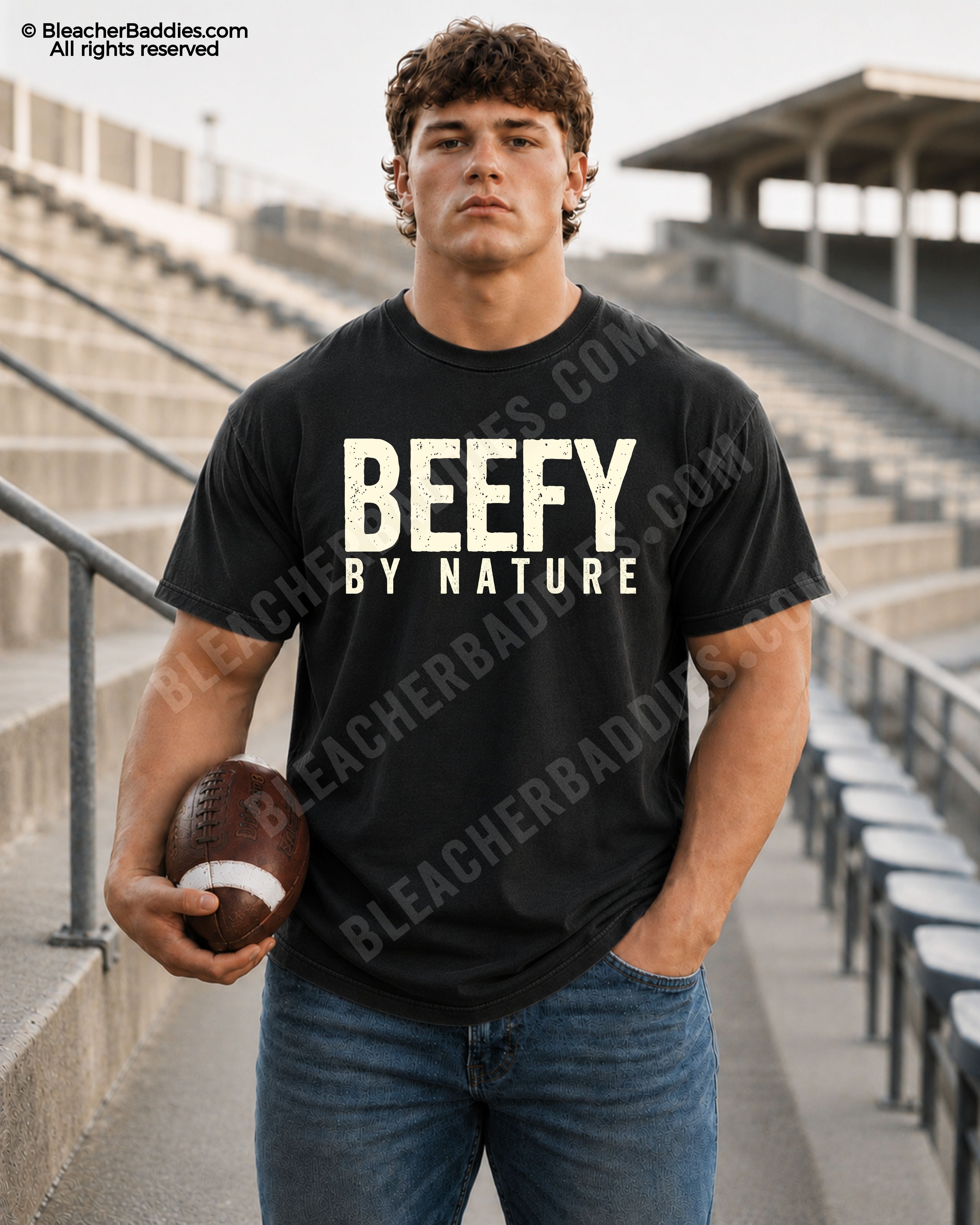 Football player standing in stadium wearing a black Comfort Colors “Beefy By Nature” game day shirt with distressed cream lettering and football aesthetic.