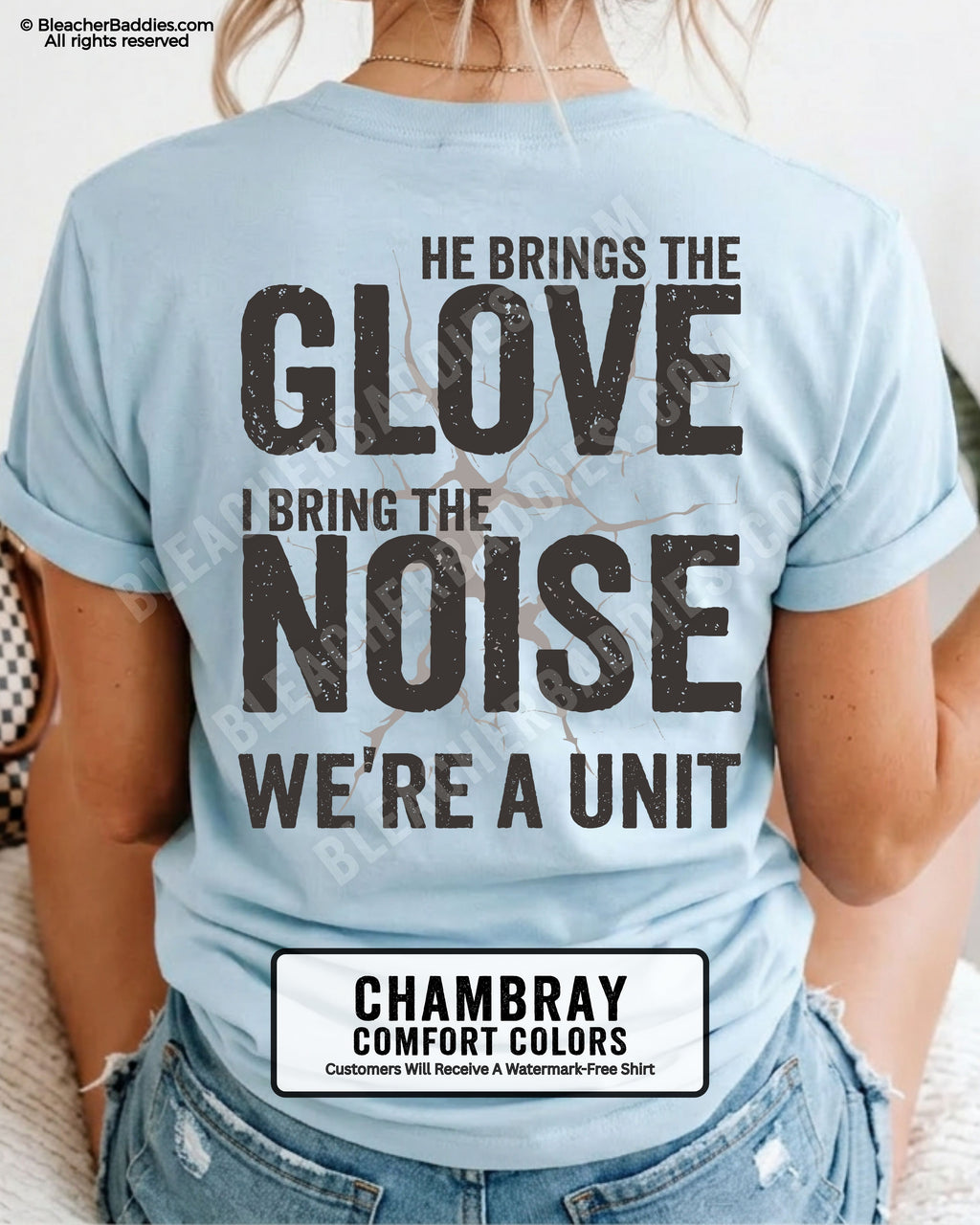 Chambray blue Comfort Colors baseball mom shirt featuring oversized distressed typography reading “He Brings The Glove I Bring The Noise We’re A Unit” with cracked vintage graphic detail and bold game day aesthetic.