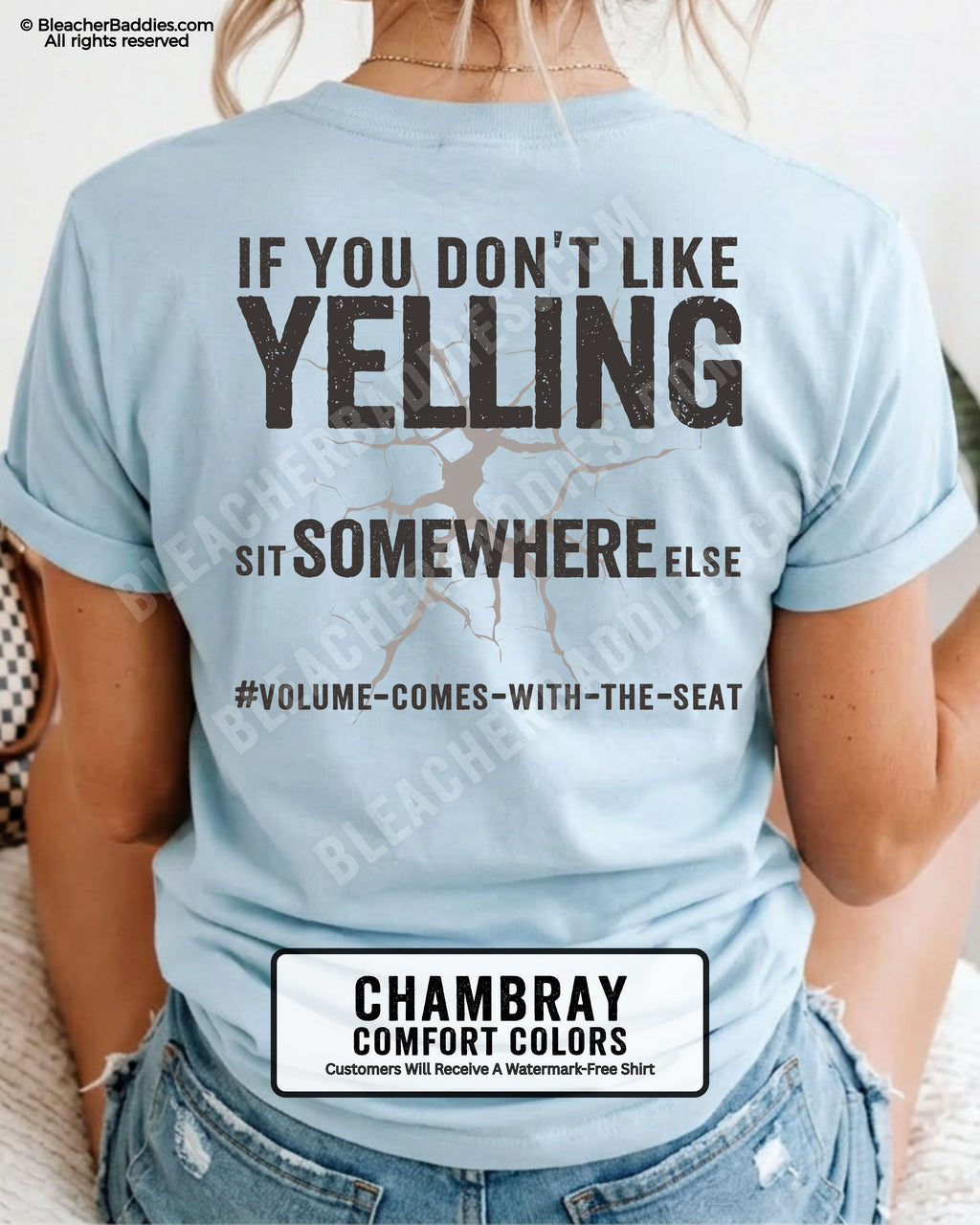 Woman wearing chambray Comfort Colors shirt with distressed text reading “If You Don’t Like Yelling Sit Somewhere Else” and “#Volume-Comes-With-The-Seat” underneath.