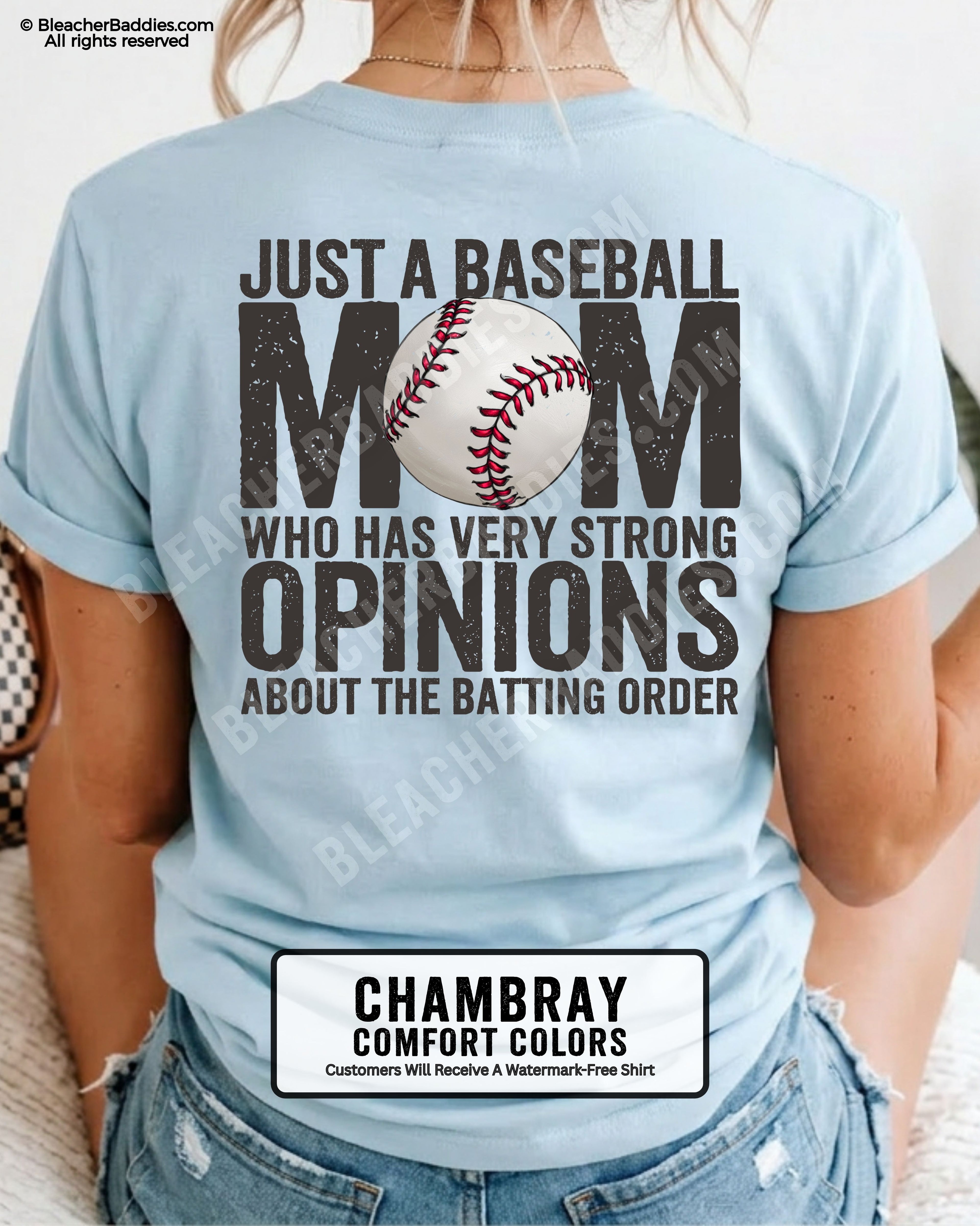 Chambray Comfort Colors game day shirt worn by woman showing distressed back graphic reading “Just a Baseball Mom Who Has Very Strong Opinions About The Batting Order” with baseball illustration over MOM text