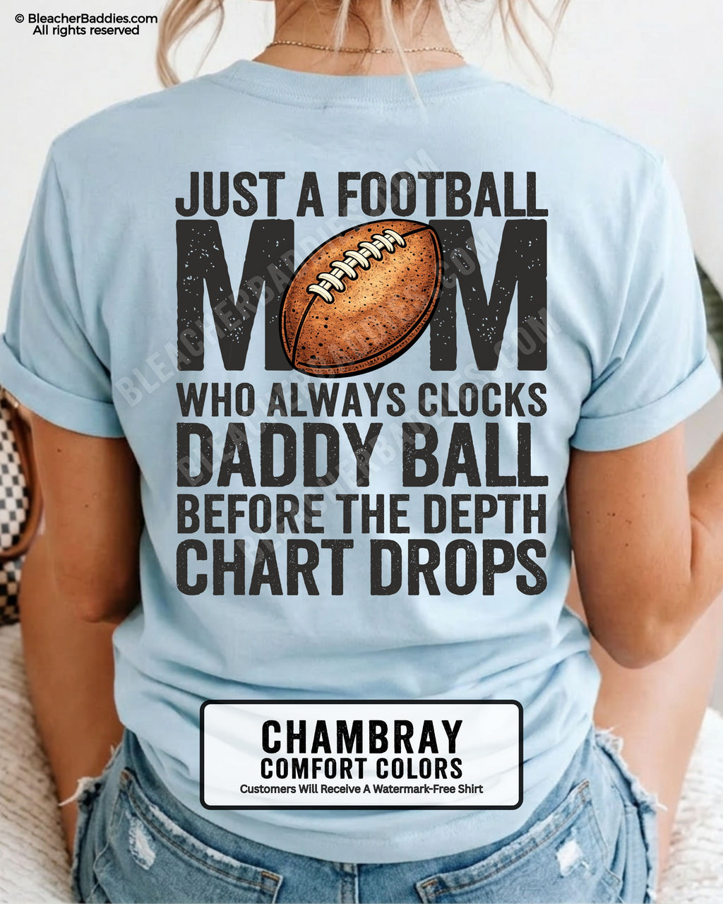 Chambray Comfort Colors t-shirt worn by woman showing back graphic reading “Just a football mom who always clocks daddy ball before the depth chart drops” with football illustration