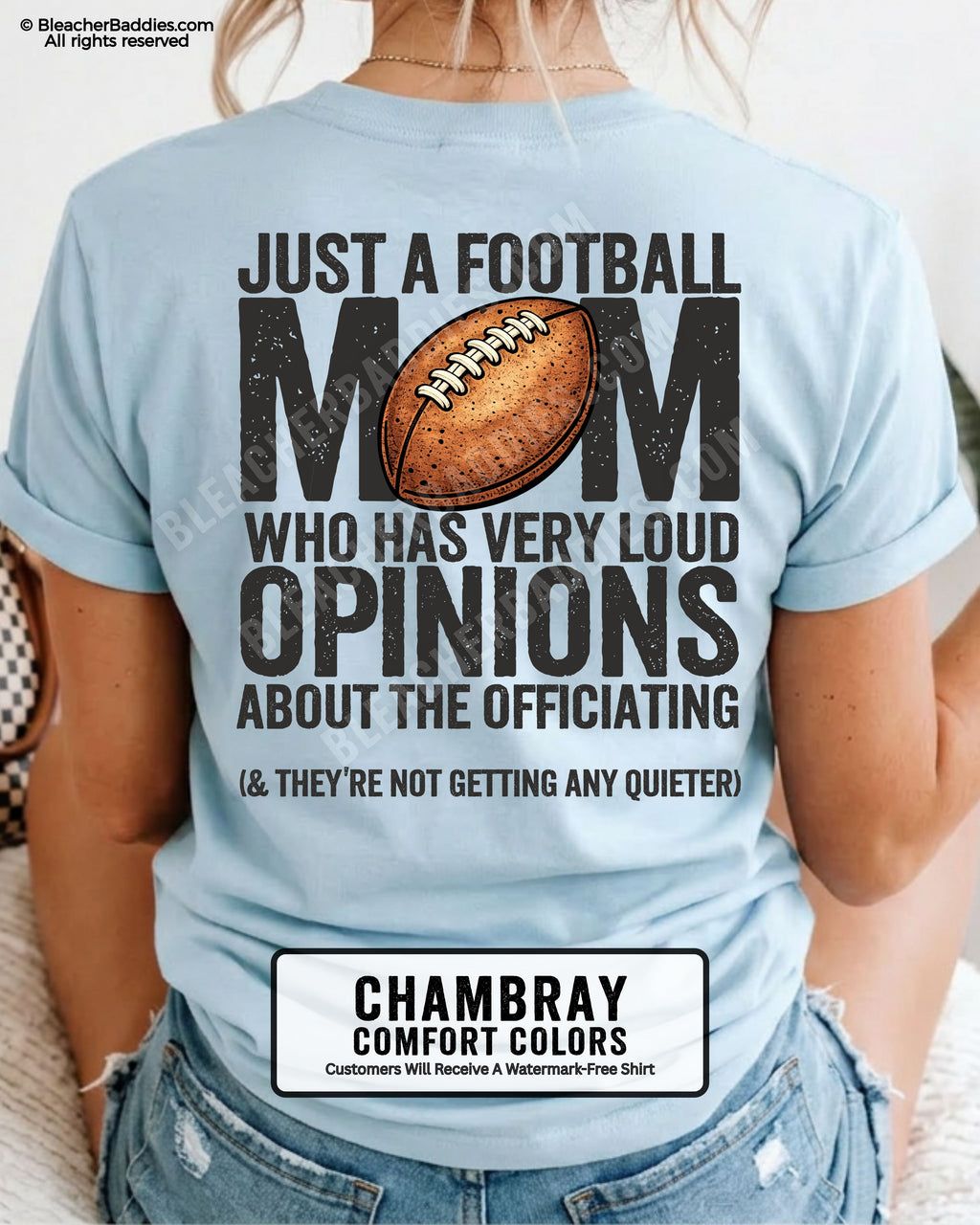 Football mom game day shirt worn by a model on a chambray Comfort Colors tee, featuring a back graphic that says, “Just a football mom who has very loud opinions about the officiating (& they’re not getting any quieter).”