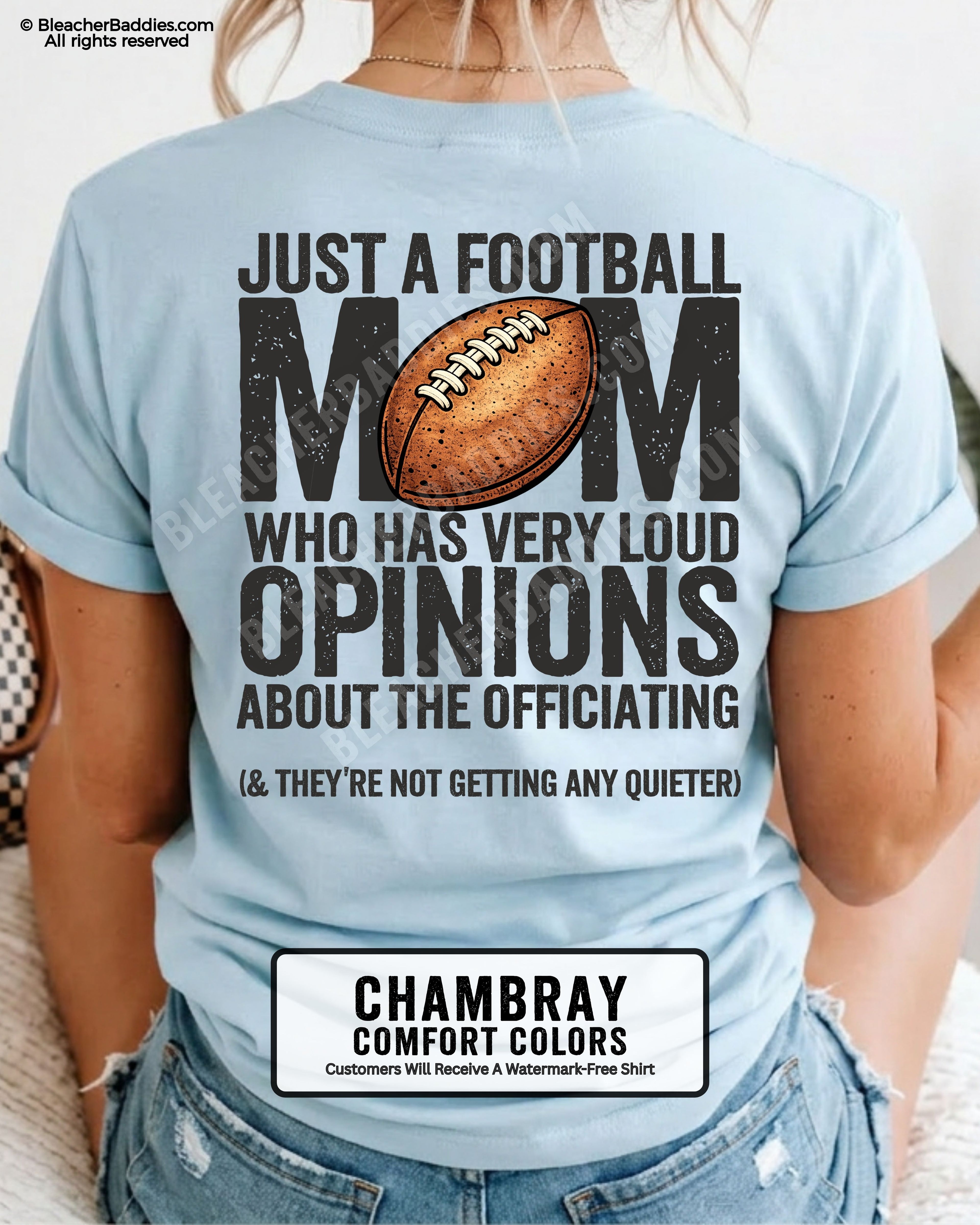 Football mom game day shirt worn by a model on a chambray Comfort Colors tee, featuring a back graphic that says, “Just a football mom who has very loud opinions about the officiating (& they’re not getting any quieter).”