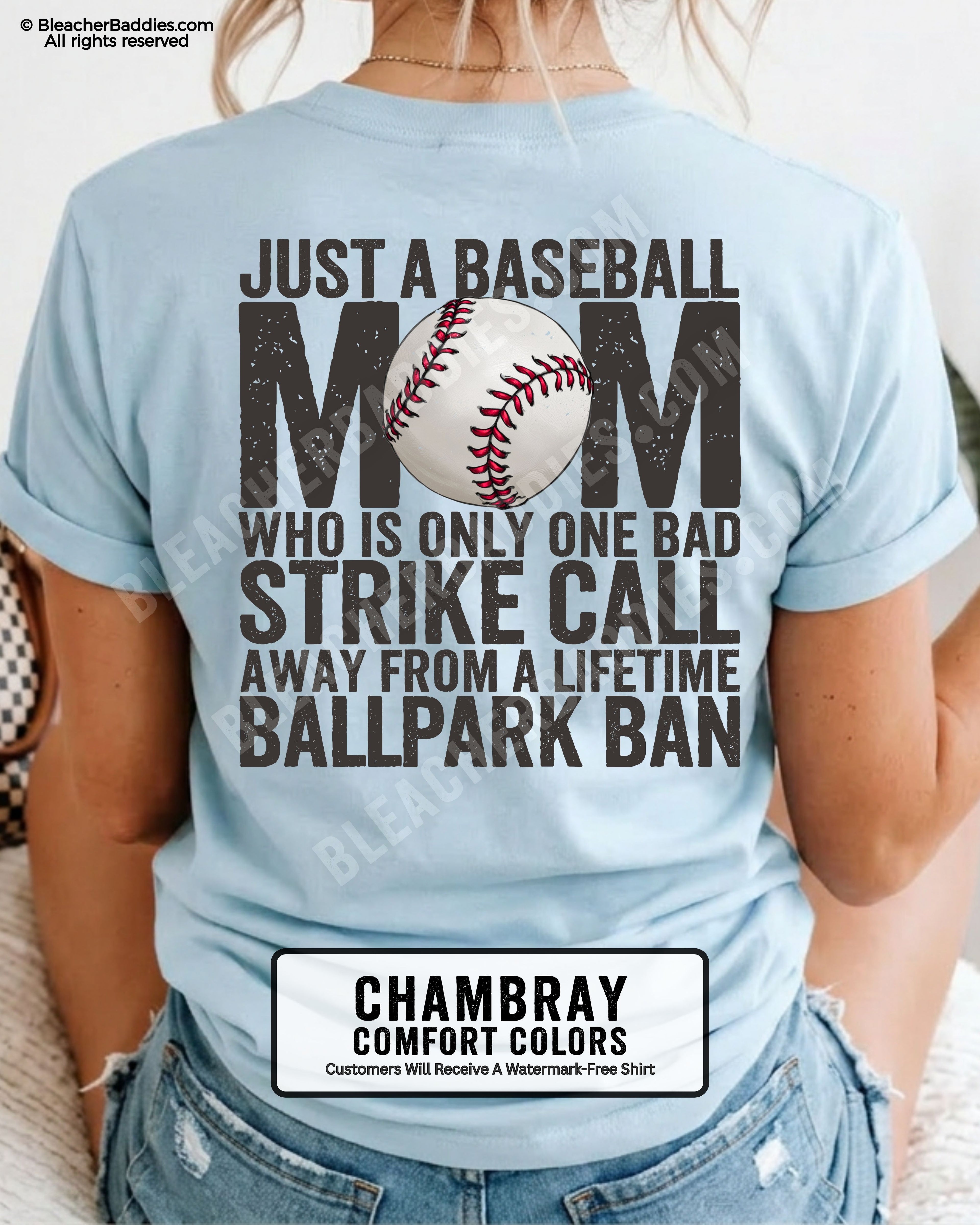 Chambray Comfort Colors game day shirt worn by woman showing distressed back graphic reading “Just a Baseball Mom Who Is Only One Bad Strike Call Away From A Lifetime Ballpark Ban” with baseball illustration layered over MOM text