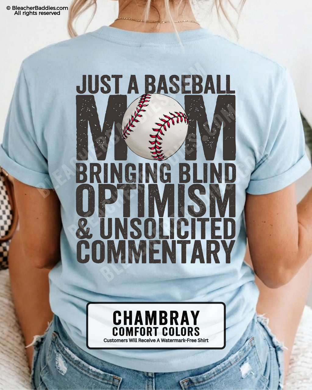 Chambray Comfort Colors game day shirt worn by woman showing distressed back graphic reading “Just a Baseball Mom Bringing Blind Optimism & Unsolicited Commentary” with baseball illustration over MOM text