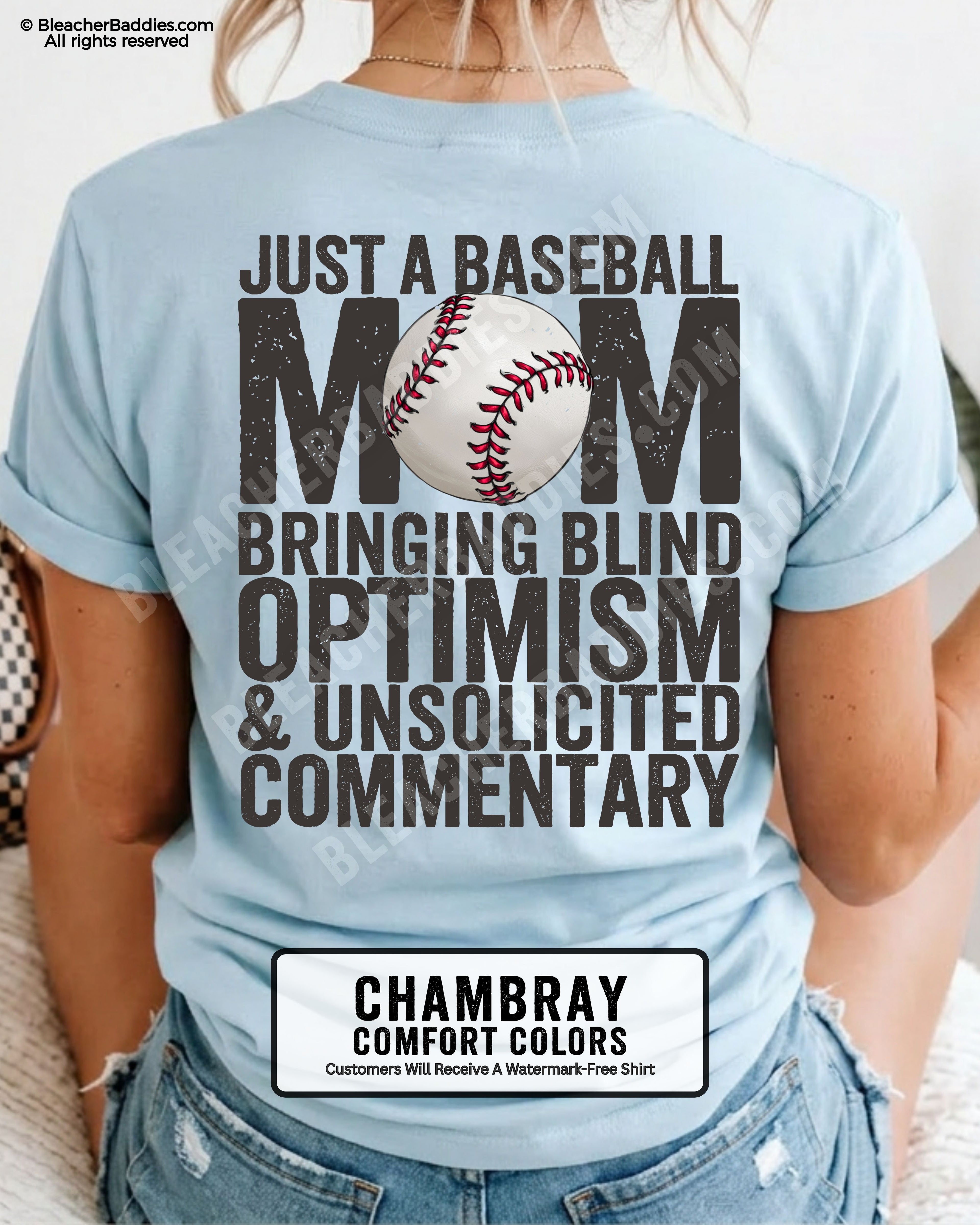 Chambray Comfort Colors game day shirt worn by woman showing distressed back graphic reading “Just a Baseball Mom Bringing Blind Optimism & Unsolicited Commentary” with baseball illustration over MOM text