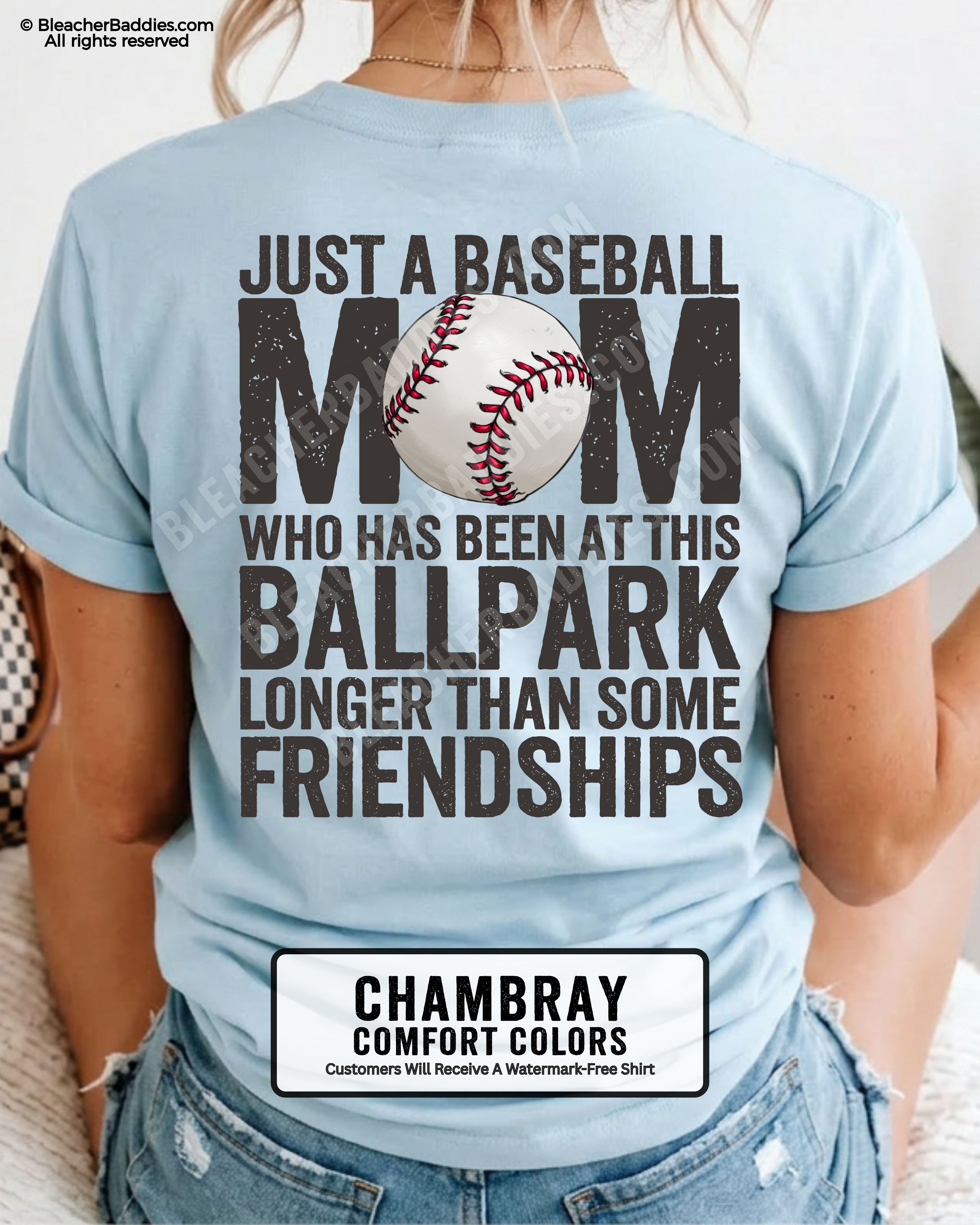 Chambray game day shirt worn by woman showing oversized distressed back graphic reading “Just a Baseball Mom Who Has Been at This Ballpark Longer Than Some Friendships” with baseball illustration over MOM text