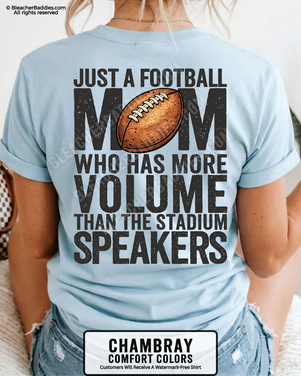Chambray Comfort Colors t-shirt worn by woman showing back graphic reading “Just a football mom who has more volume than the stadium speakers” with football illustration