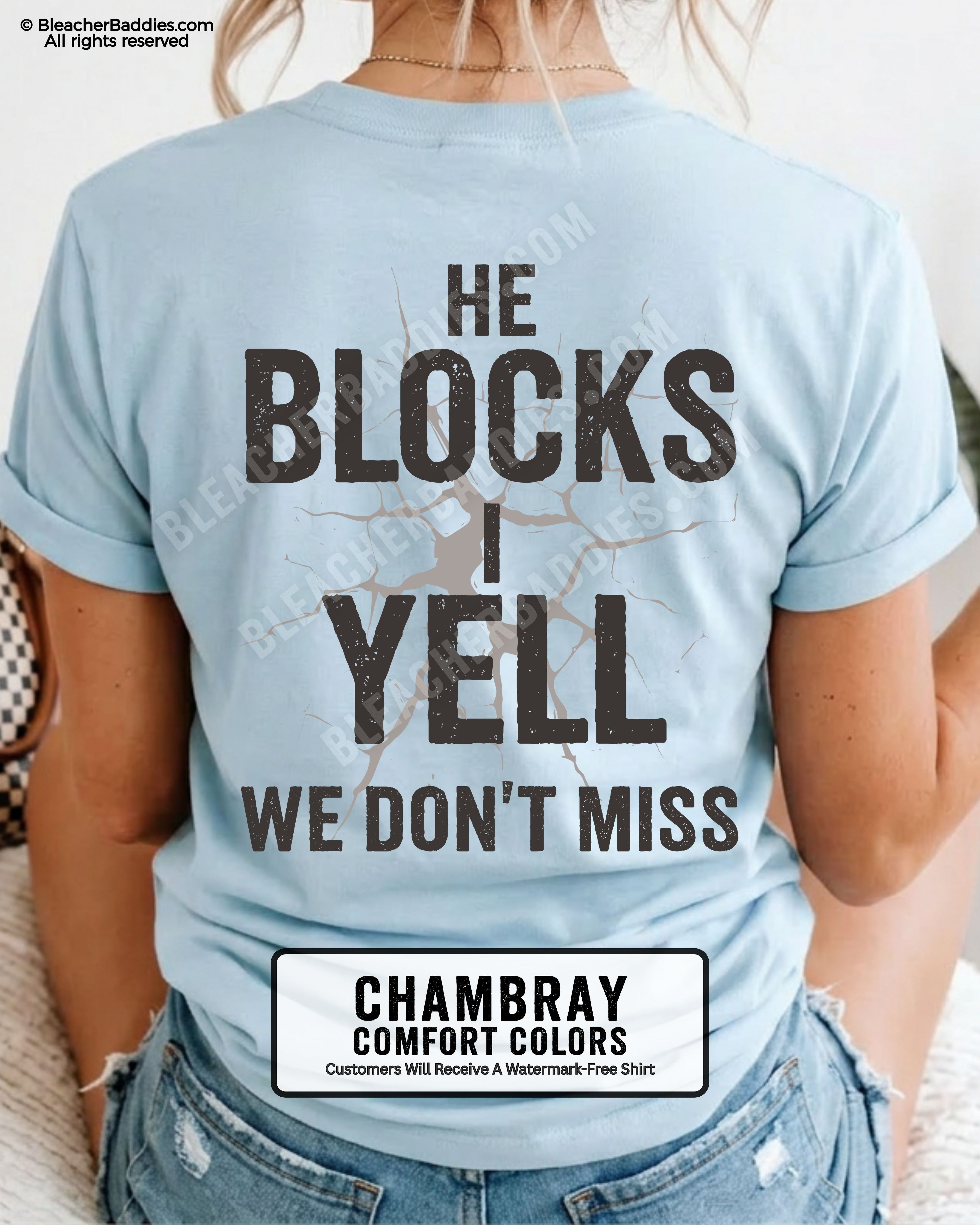 Woman wearing CHAMBRAY BLUE  Comfort Colors football mom game day shirt with back design that reads “He blocks I yell we don’t miss” in distressed black text with cracked graphic and ivory color label shown