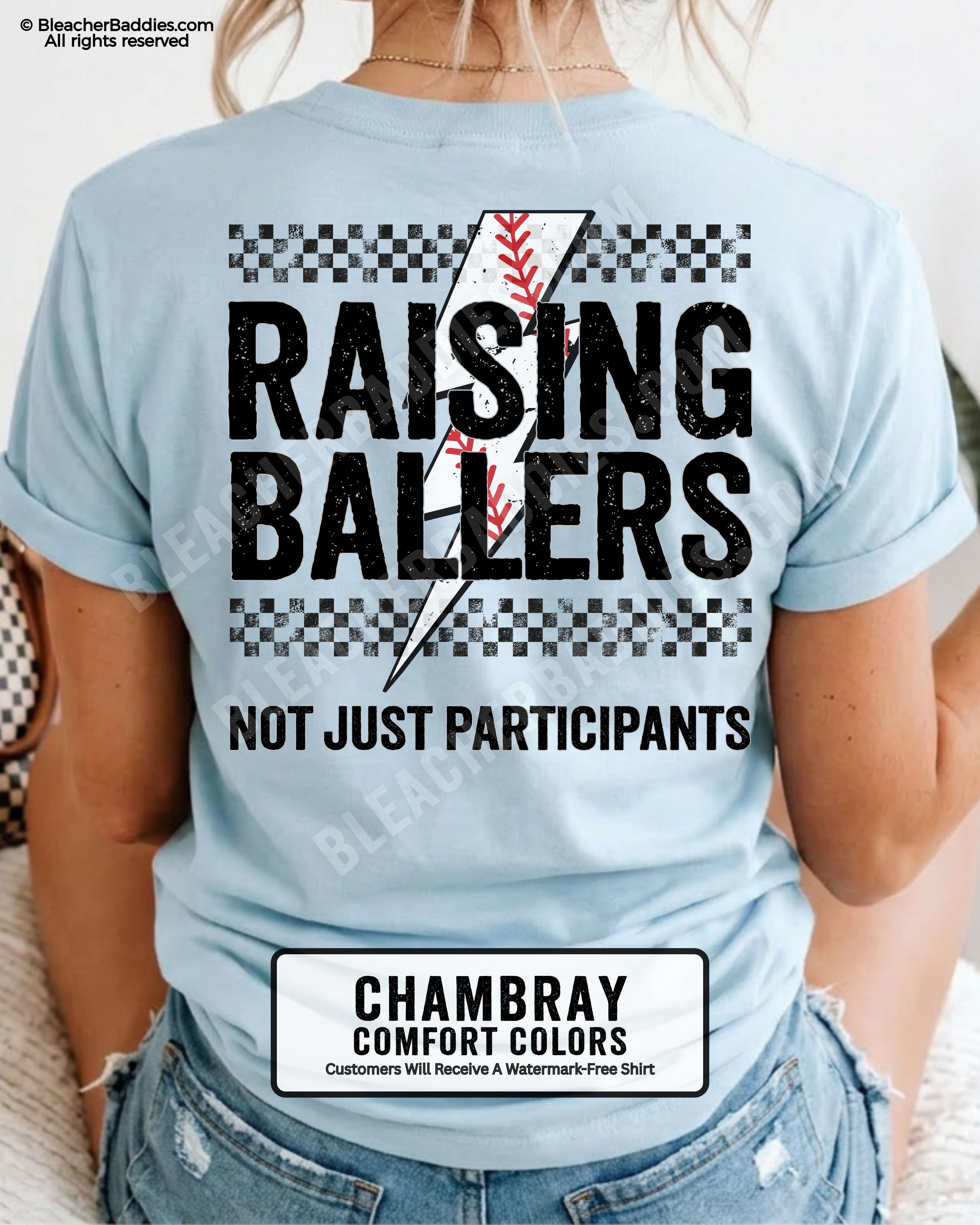 Chambray Comfort Colors baseball game day shirt featuring oversized distressed Raising Ballers text, black checkerboard accents, red baseball stitching graphic, and “Not Just Participants” slogan on back print.