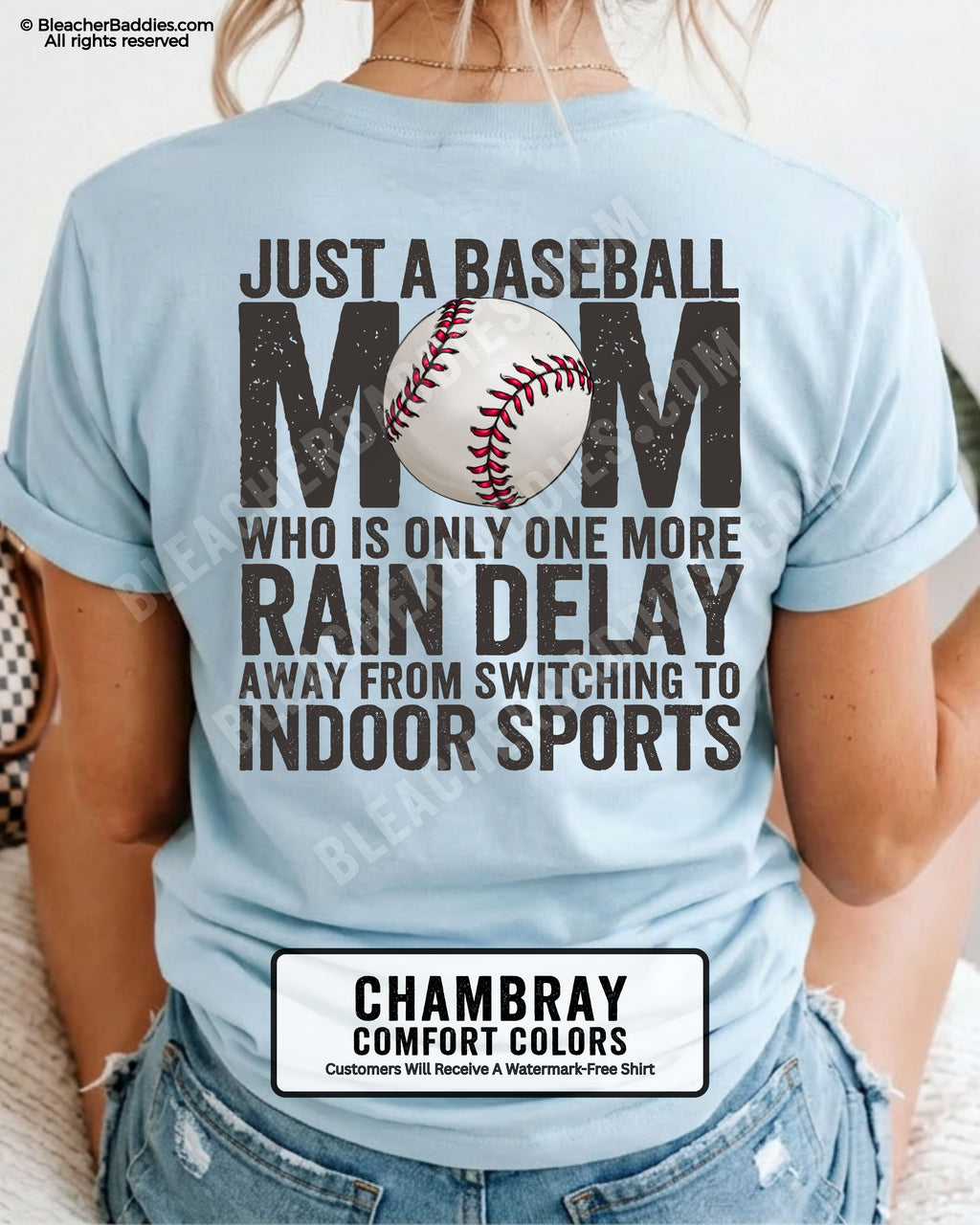 Chambray Comfort Colors game day shirt worn by woman showing distressed back graphic reading “Just a Baseball Mom Who Is Only One More Rain Delay Away From Switching To Indoor Sports” with baseball illustration over MOM text