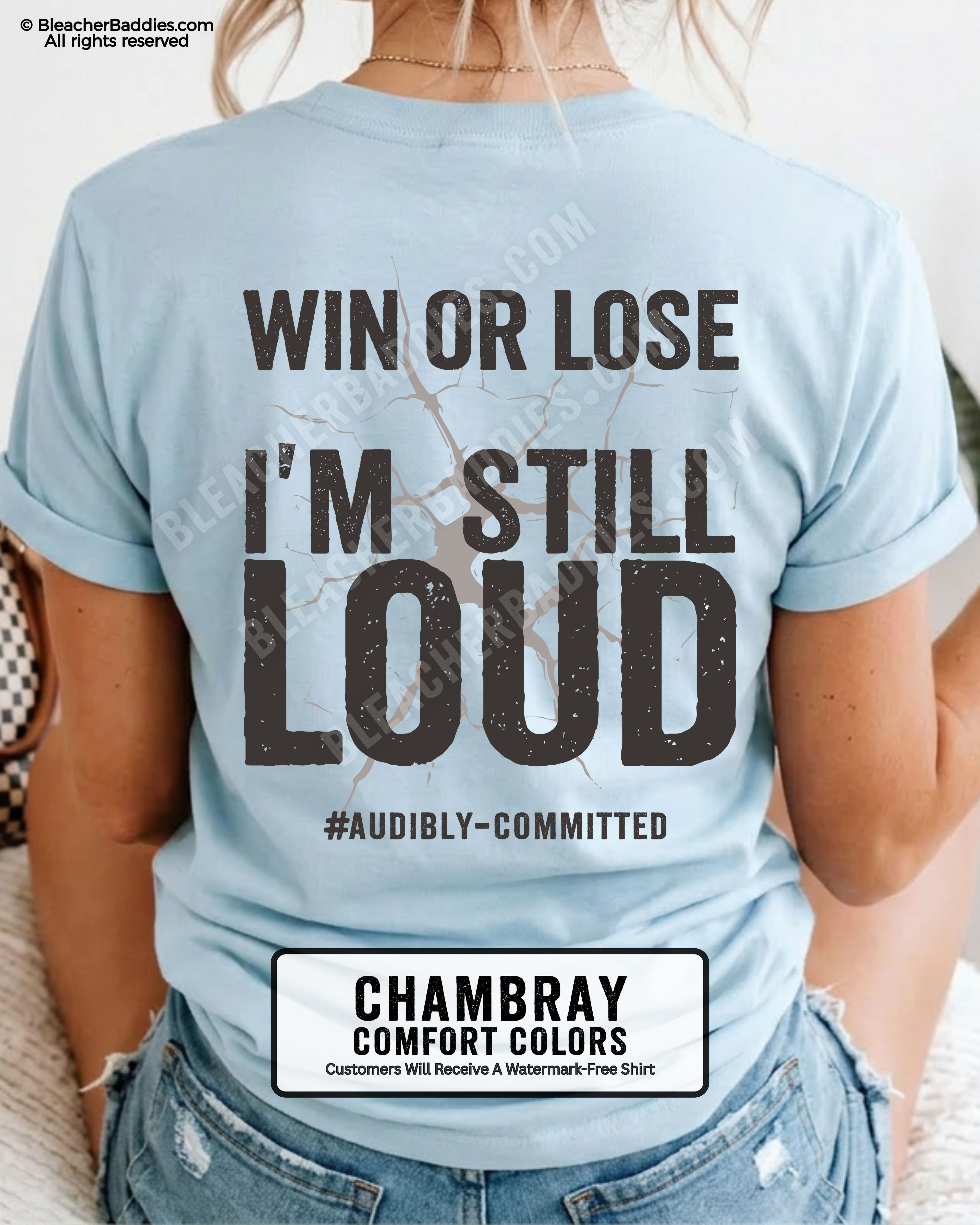 Woman wearing a chambray blue Comfort Colors t-shirt shown from the back featuring a large distressed black graphic that reads “Win or Lose I’m Still Loud #Audibly Committed.”