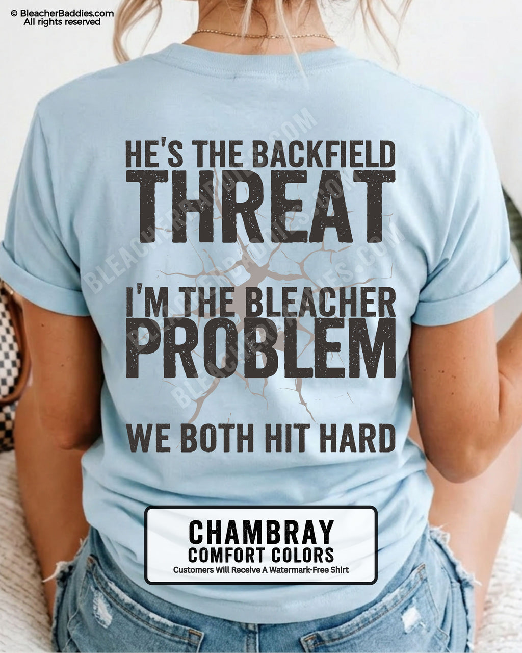 Back view of football mom wearing CHAMBRAY Comfort Colors game day shirt with “He’s the Backfield Threat I’m the Bleacher Problem We Both Hit Hard” graphic design