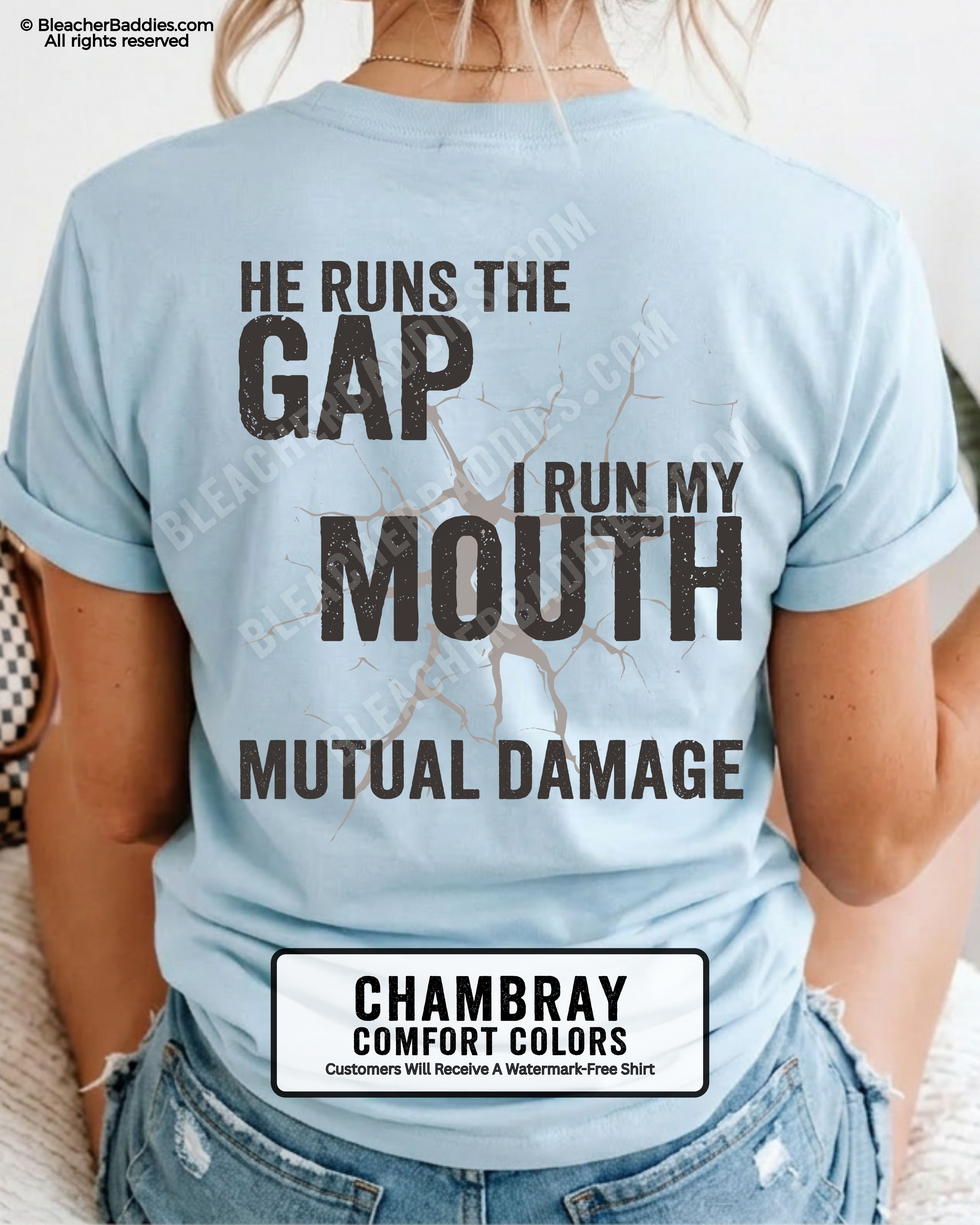 Back view of football mom wearing chambray Comfort Colors game day shirt with “He Runs the Gap I Run My Mouth Mutual Damage” graphic design