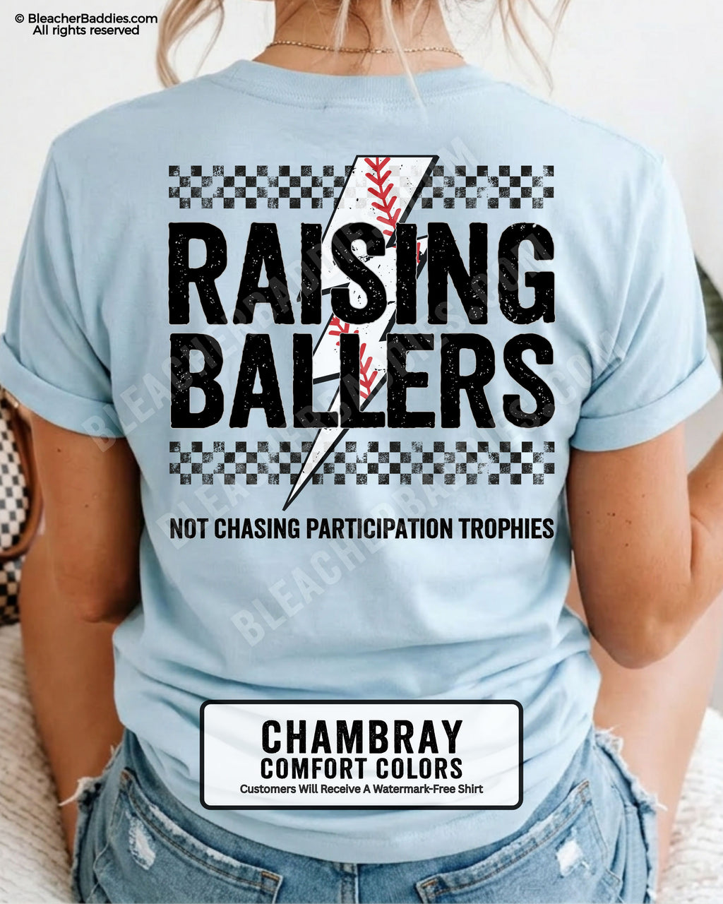 Chambray Comfort Colors baseball mom shirt featuring a distressed Raising Ballers design with checkerboard details, red baseball stitch graphic, and bold “Not Chasing Participation Trophies” game day slogan.