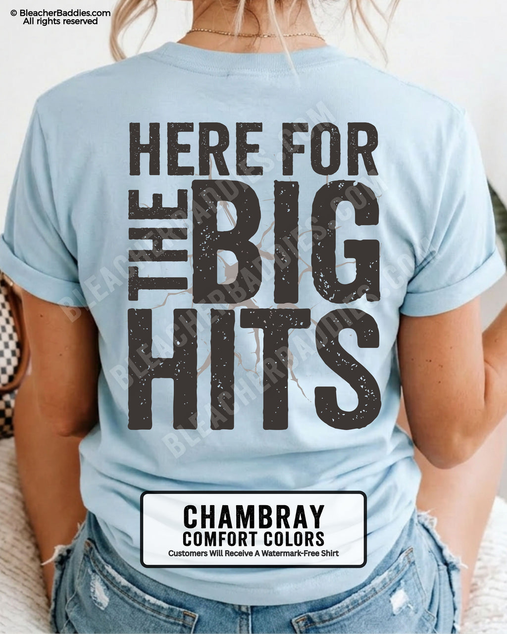 Chambray blue Comfort Colors baseball mom graphic tee with oversized distressed typography reading “Here For The Big Hits” across the back