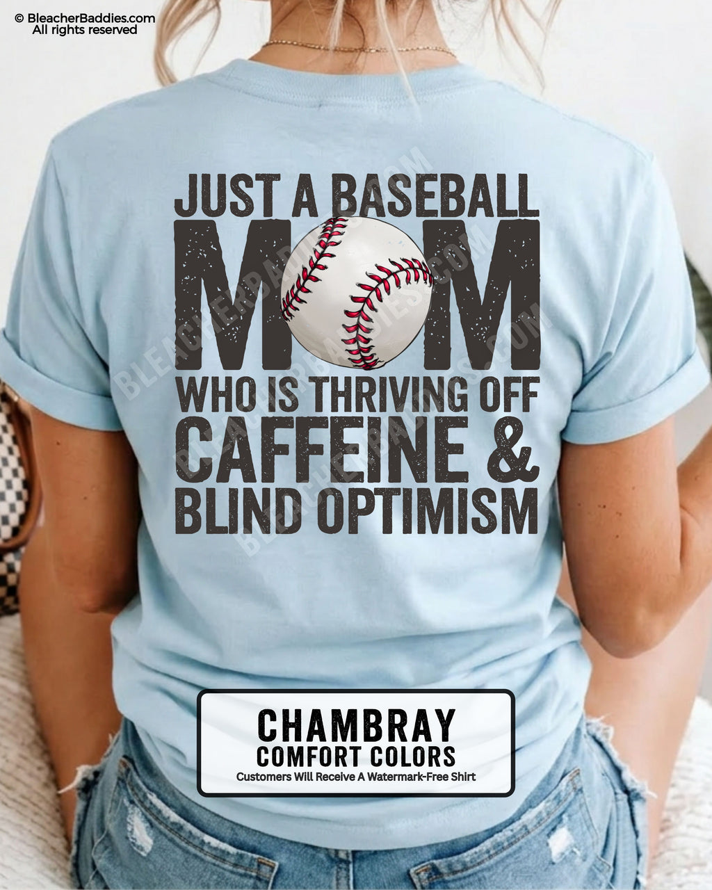 Chambray baseball mom game day shirt with distressed black back graphic reading “Just a baseball mom who is thriving off caffeine and blind optimism” with baseball illustration replacing the O in MOM