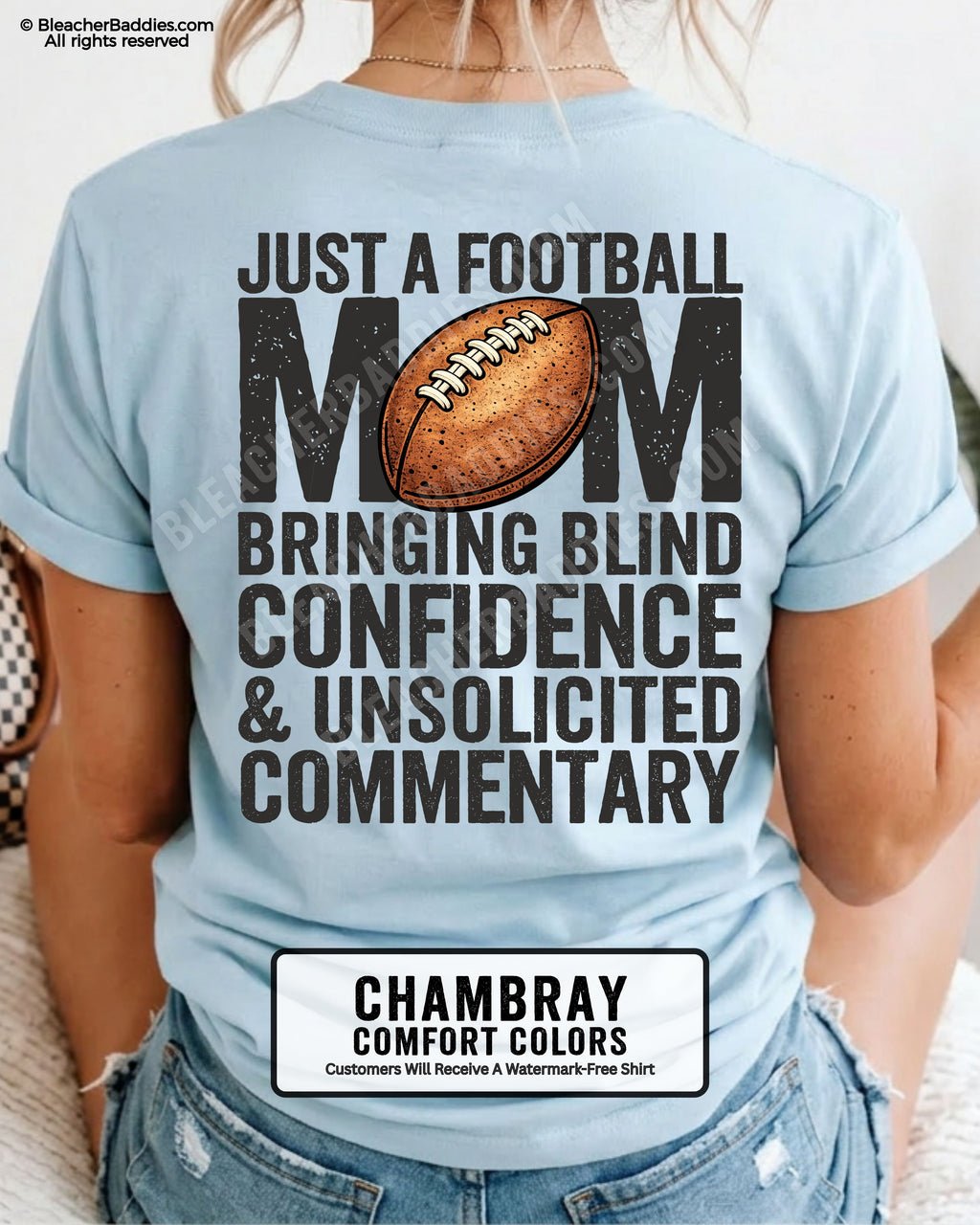 Chambray Comfort Colors t-shirt worn by woman showing back graphic reading “Just a football mom bringing blind confidence & unsolicited commentary” with football illustration