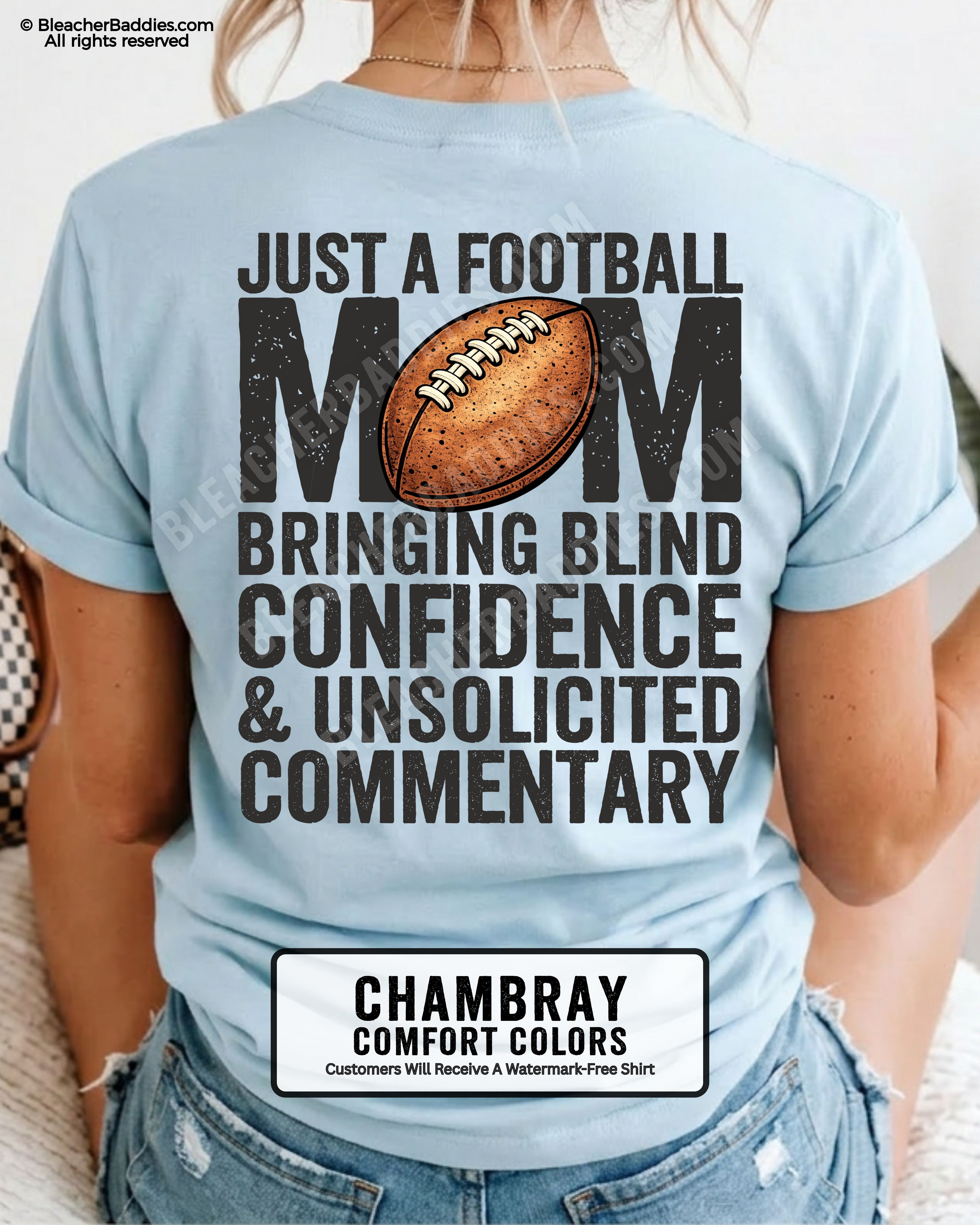 Chambray Comfort Colors t-shirt worn by woman showing back graphic reading “Just a football mom bringing blind confidence & unsolicited commentary” with football illustration