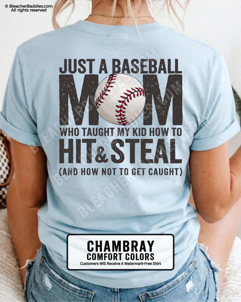Chambray Comfort Colors game day shirt worn by woman showing distressed back graphic reading “Just a Baseball Mom Who Taught My Kid How to Hit & Steal (And How Not to Get Caught)” with baseball illustration over MOM text