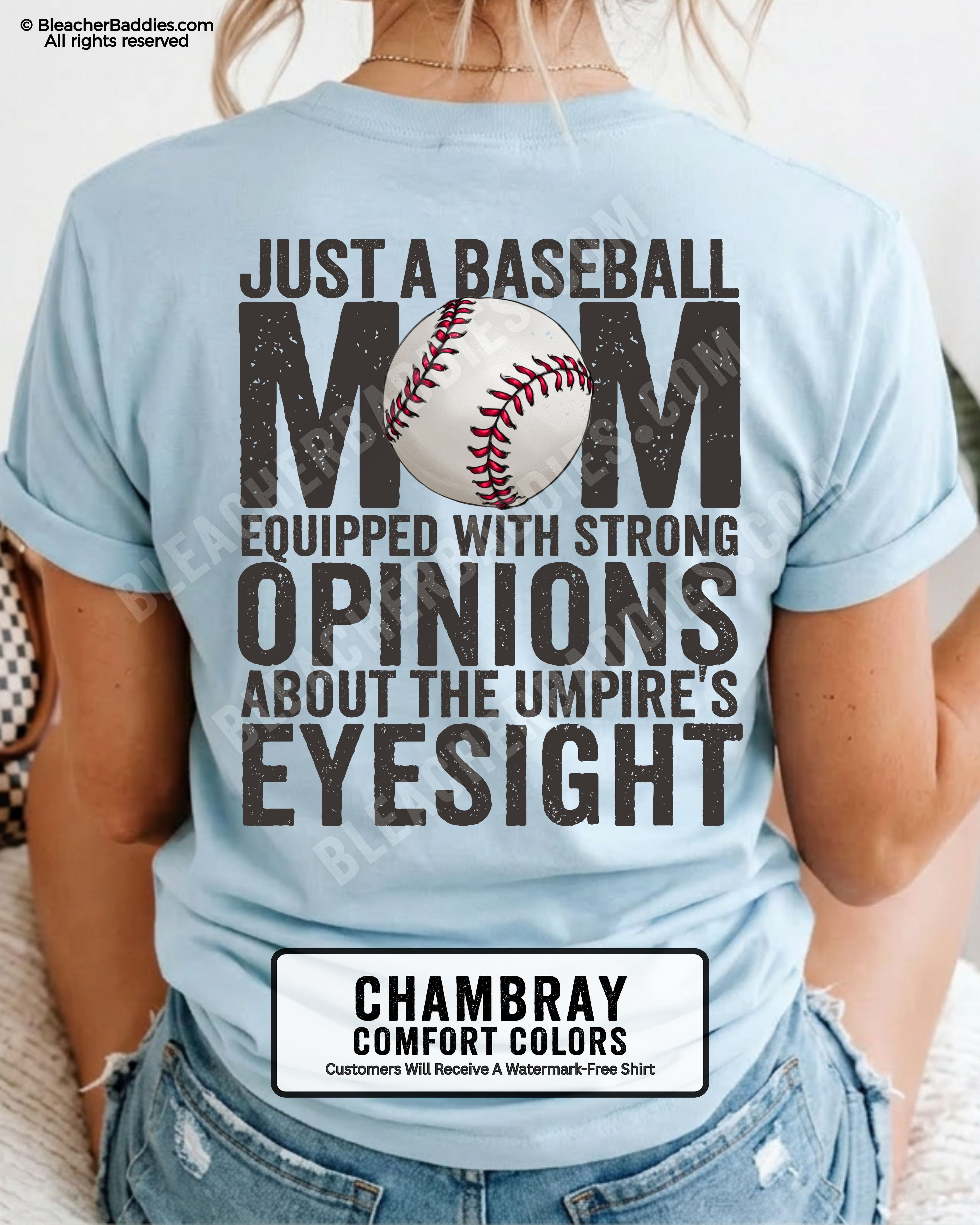 Chambray Comfort Colors game day shirt worn by woman showing distressed back graphic reading “Just a Baseball Mom Equipped With Strong Opinions About The Umpire’s Eyesight” with baseball illustration layered over MOM text