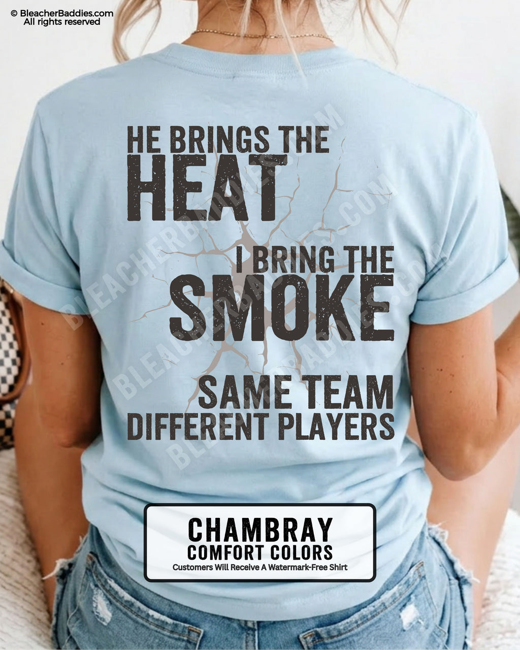 Woman wearing chambray Comfort Colors shirt with distressed text reading “He Brings The Heat I Bring The Smoke Same Team Different Players.”