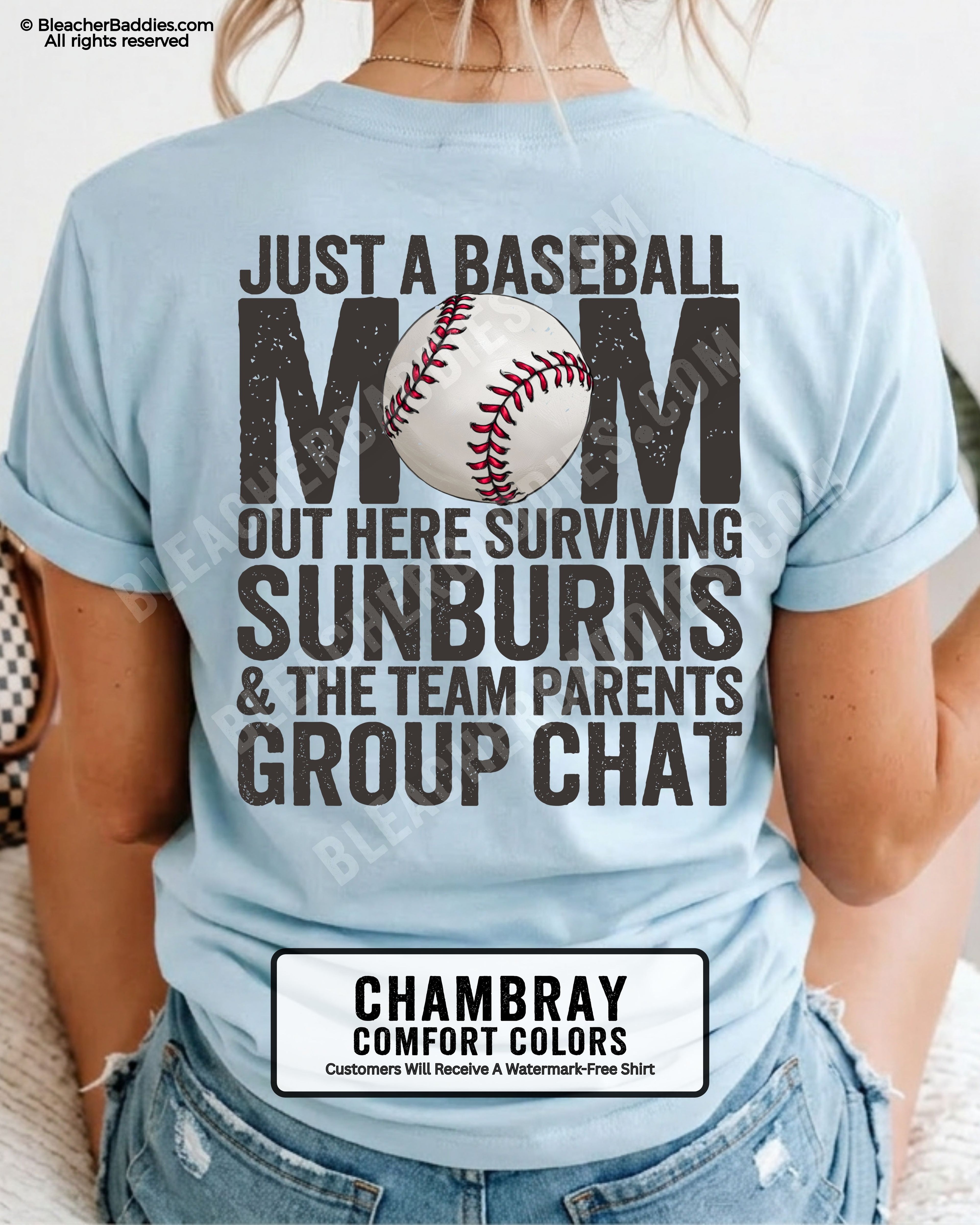 Chambray Comfort Colors game day shirt worn by woman showing distressed back graphic reading “Just a Baseball Mom Out Here Surviving Sunburns & The Team Parents Group Chat” with baseball illustration layered over MOM text