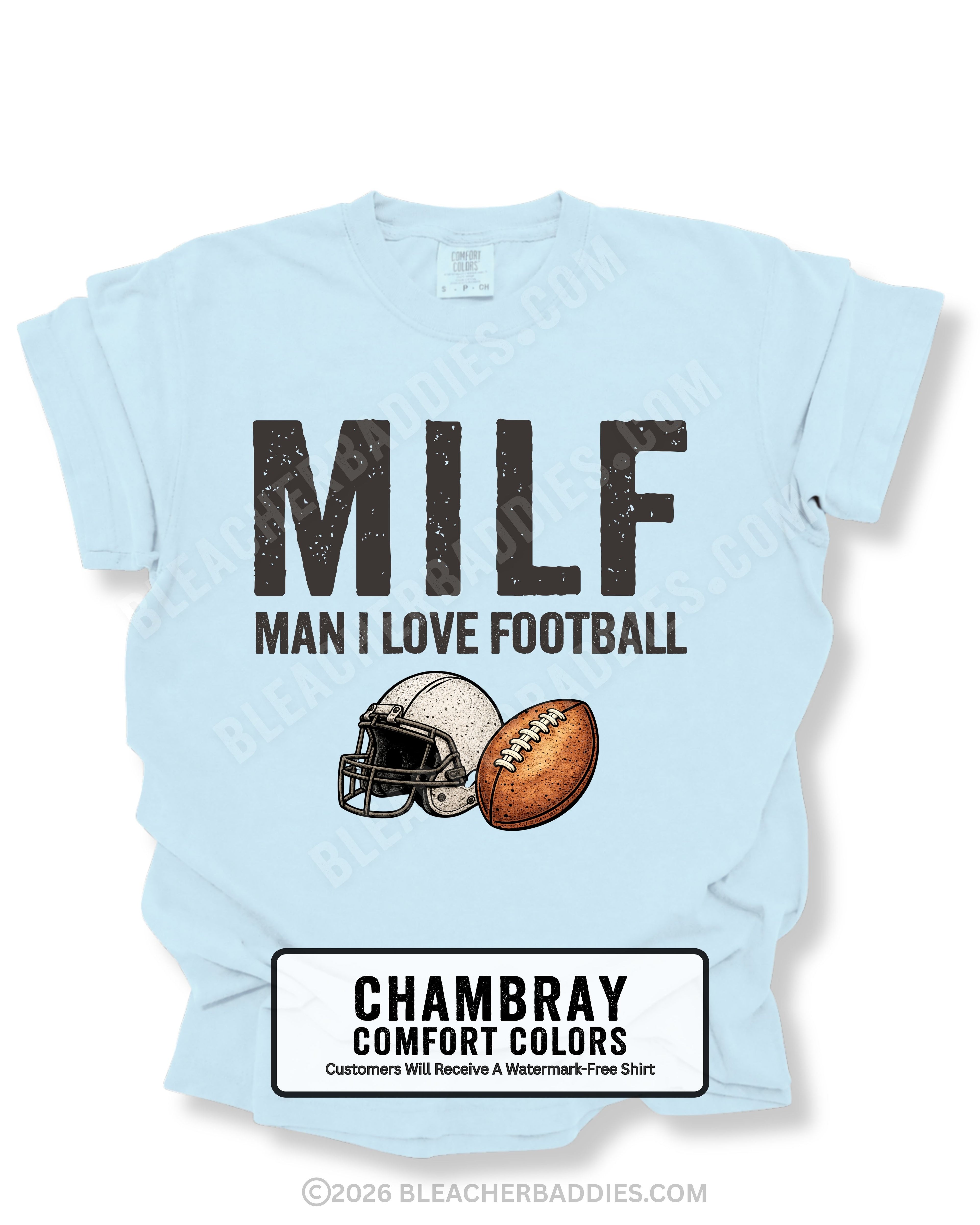 Flat lay of a chambray Comfort Colors t-shirt featuring the distressed ivory text "MILF" with the phrase "MAN I LOVE FOOTBALL" underneath, along with a vintage-style white football helmet and brown football graphic. bold and humorous football fan design perfect for football moms, tailgates, and game day.