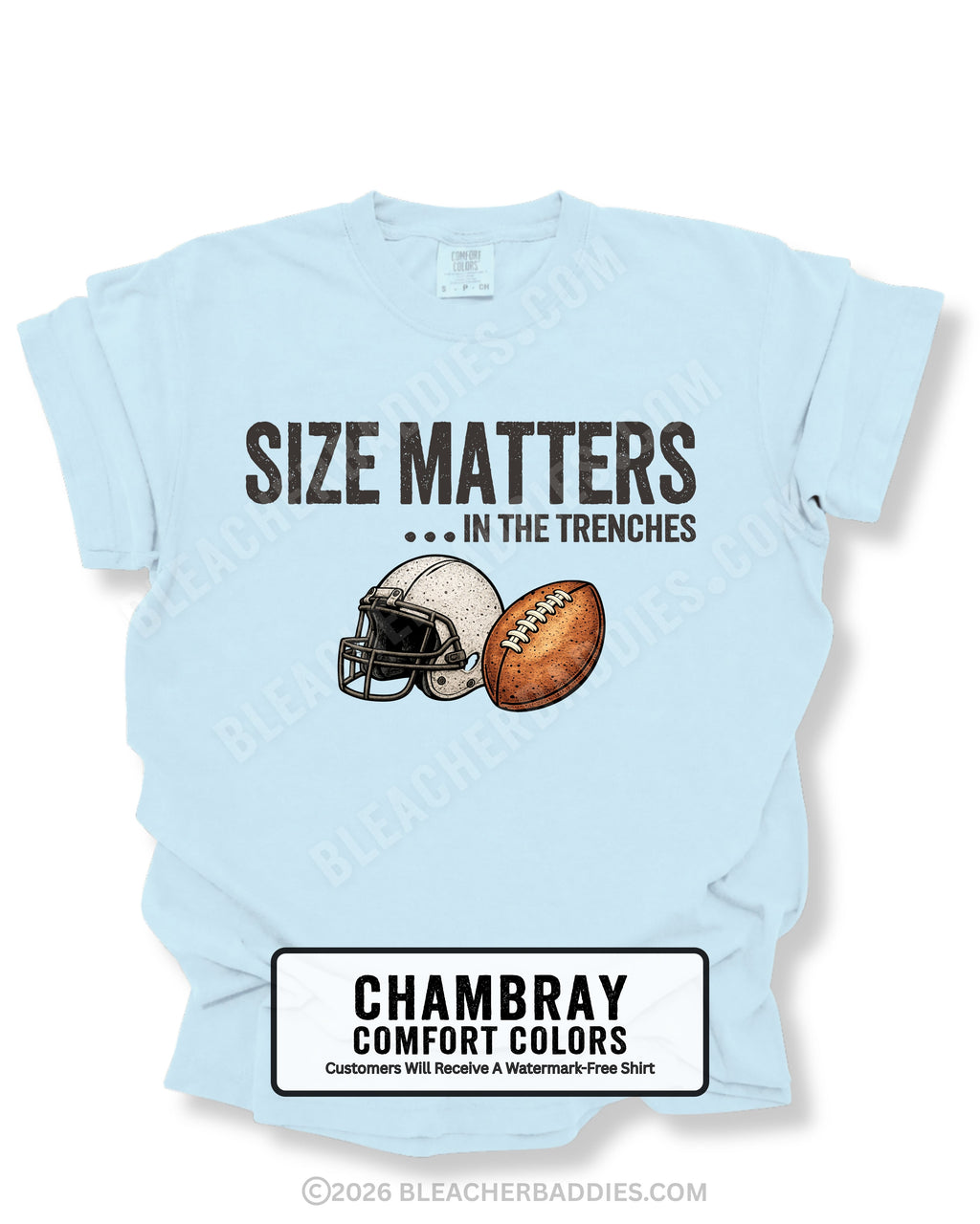 Flat lay mockup of a chambray blue Comfort Colors t-shirt featuring the funny football saying "Size Matters... In the Trenches" with a vintage football helmet and football graphic. Perfect game day shirt for football fans, offensive linemen, lineman moms, football moms, coaches, players, and anyone who knows games are won in the trenches.
