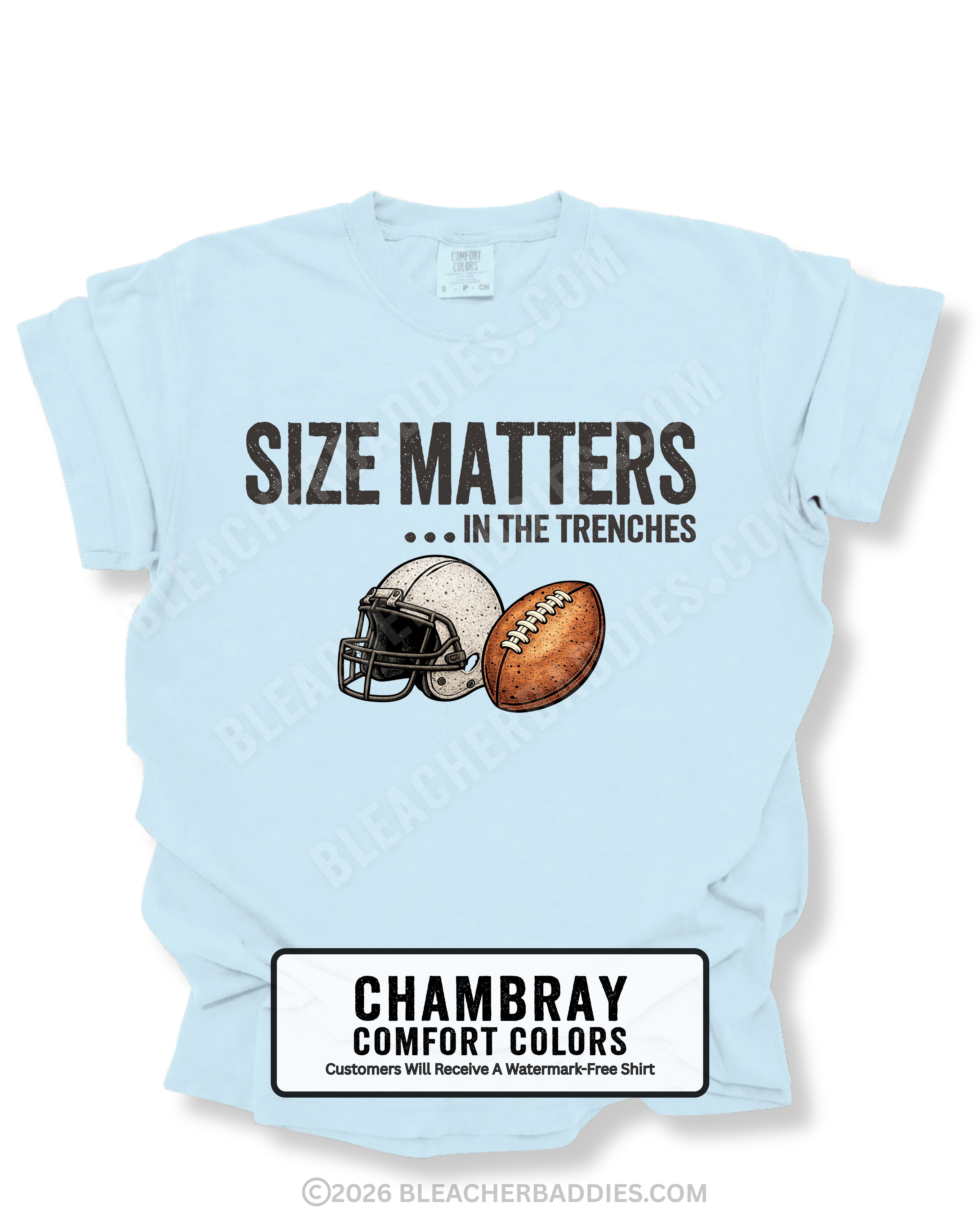 Flat lay mockup of a chambray blue Comfort Colors t-shirt featuring the funny football saying "Size Matters... In the Trenches" with a vintage football helmet and football graphic. Perfect game day shirt for football fans, offensive linemen, lineman moms, football moms, coaches, players, and anyone who knows games are won in the trenches.