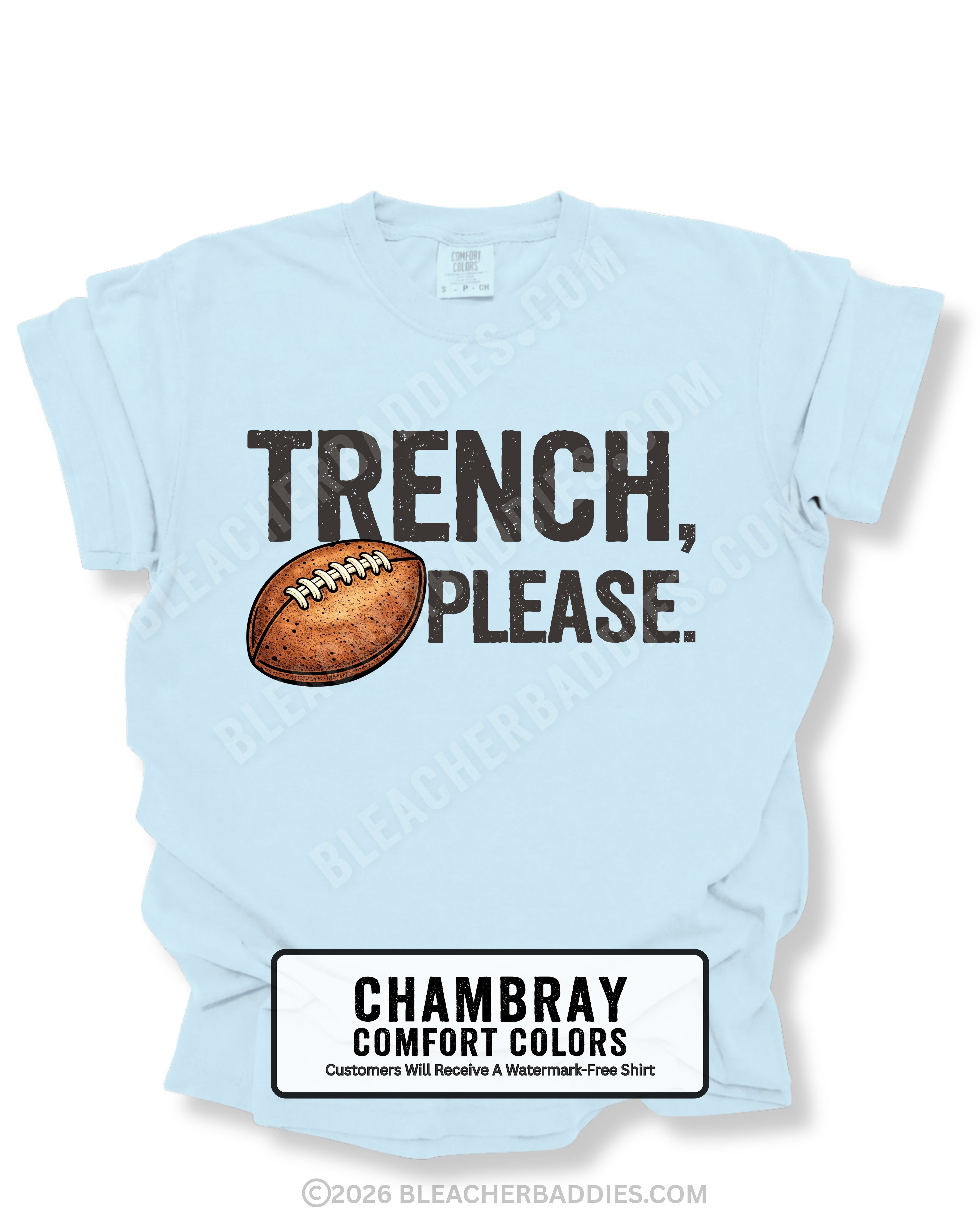 Flat lay mockup of a chambray blue Comfort Colors t-shirt featuring the funny football saying "Trench, Please." in distressed dark lettering with a vintage football graphic. A humorous game day shirt for football fans, offensive line supporters, linemen, coaches, football moms, and anyone who knows the trenches are where games are won.