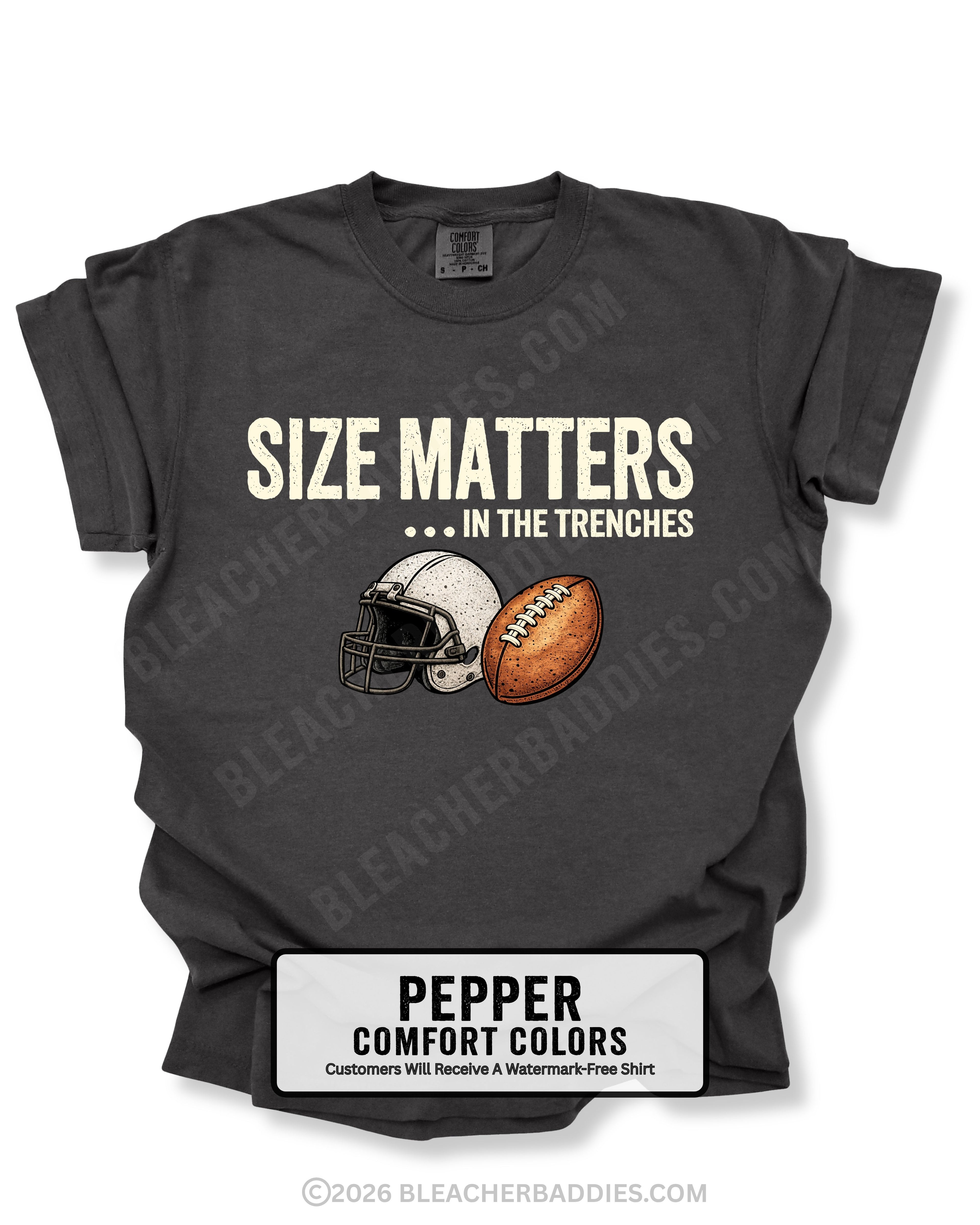 Flat lay mockup of a pepper Comfort Colors t-shirt featuring the funny football saying "Size Matters... In the Trenches" with a vintage football helmet and football graphic. Perfect game day shirt for football fans, offensive linemen, lineman moms, football moms, coaches, players, and anyone who knows games are won in the trenches.