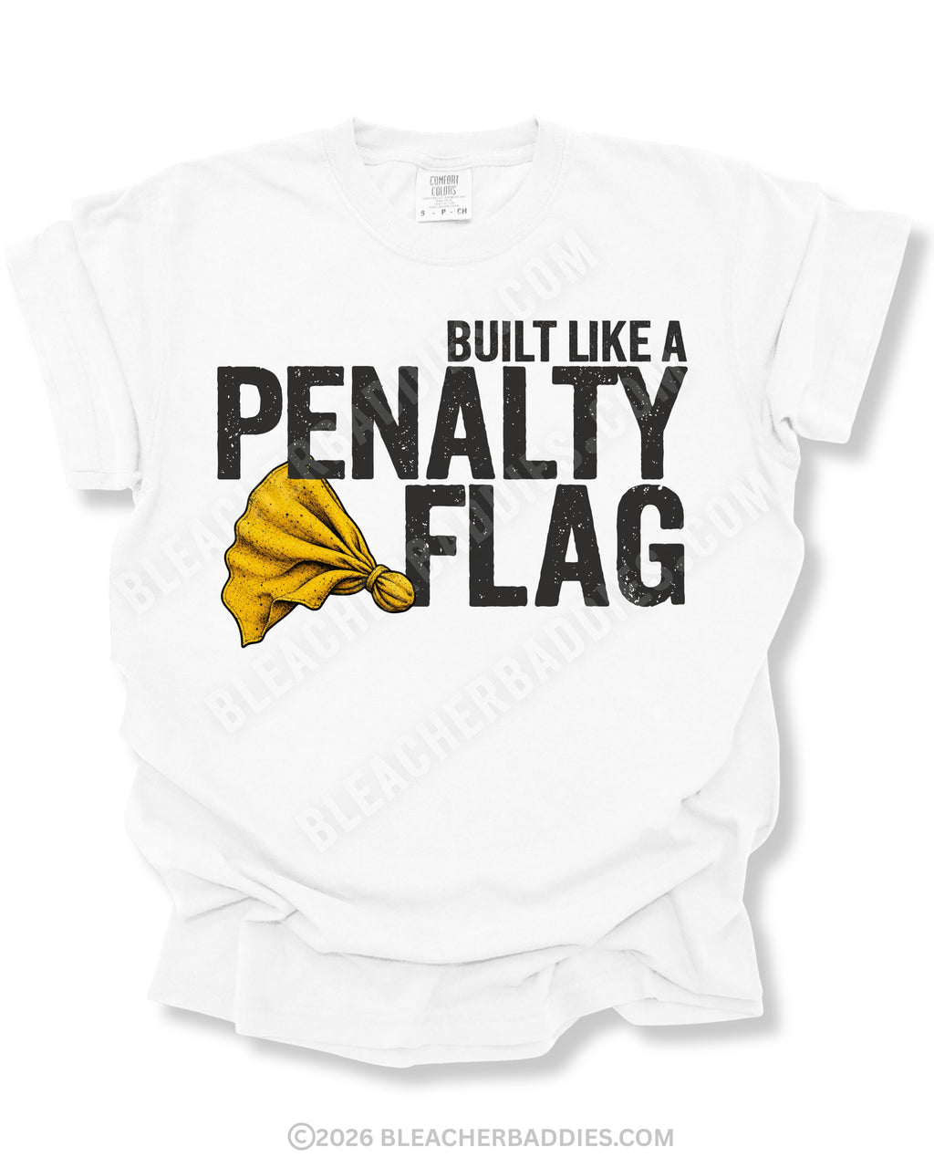 Flat lay mockup of a white Comfort Colors style football shirt featuring distressed black typography reading “Built Like A Penalty Flag” with a gritty yellow penalty flag graphic layered between the text on a soft folded white tee background.