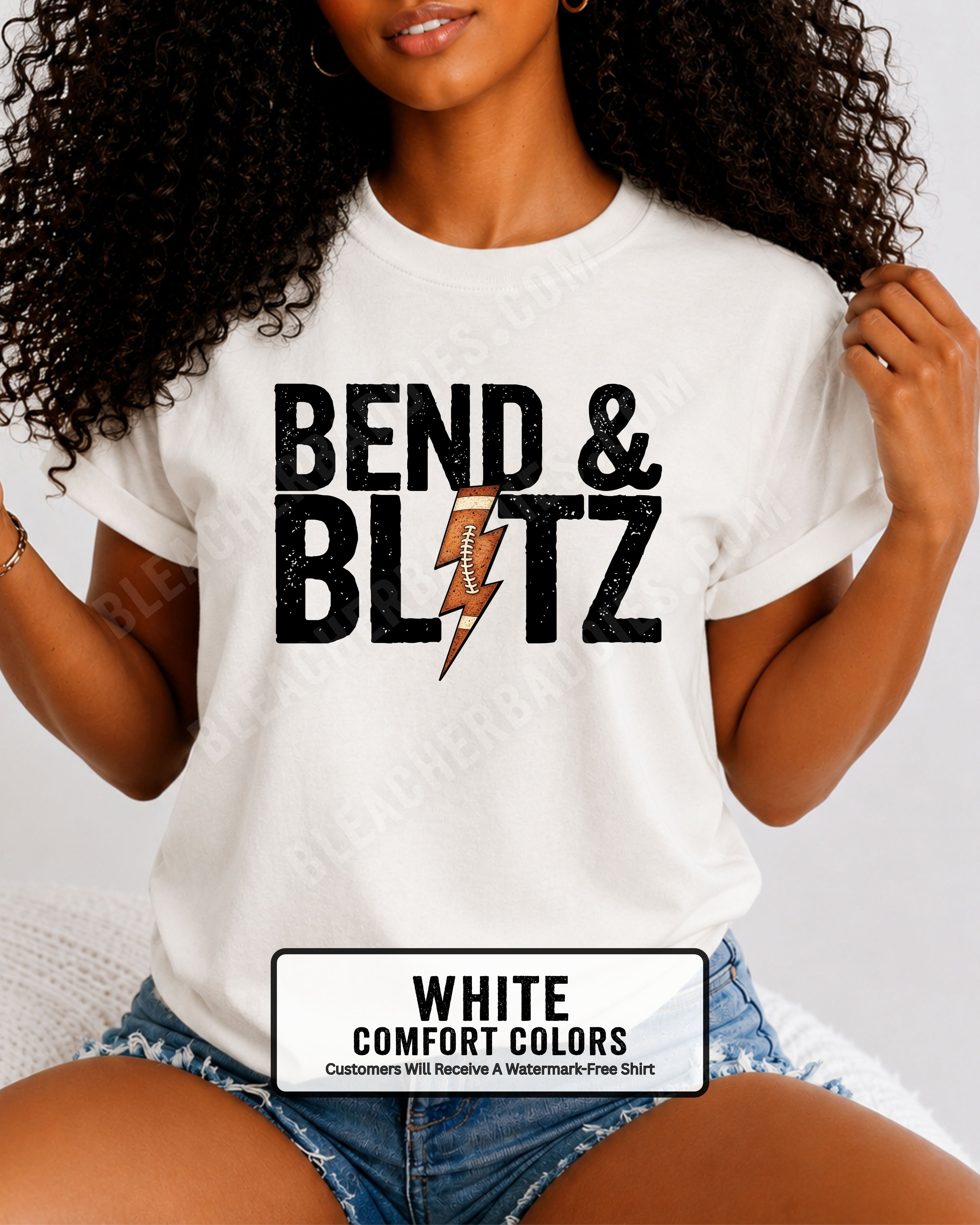 Close-up lifestyle photo of a football mom wearing a white Comfort Colors t-shirt with the distressed black graphic "BEND & BLITZ" and a football lightning bolt design between the words. 