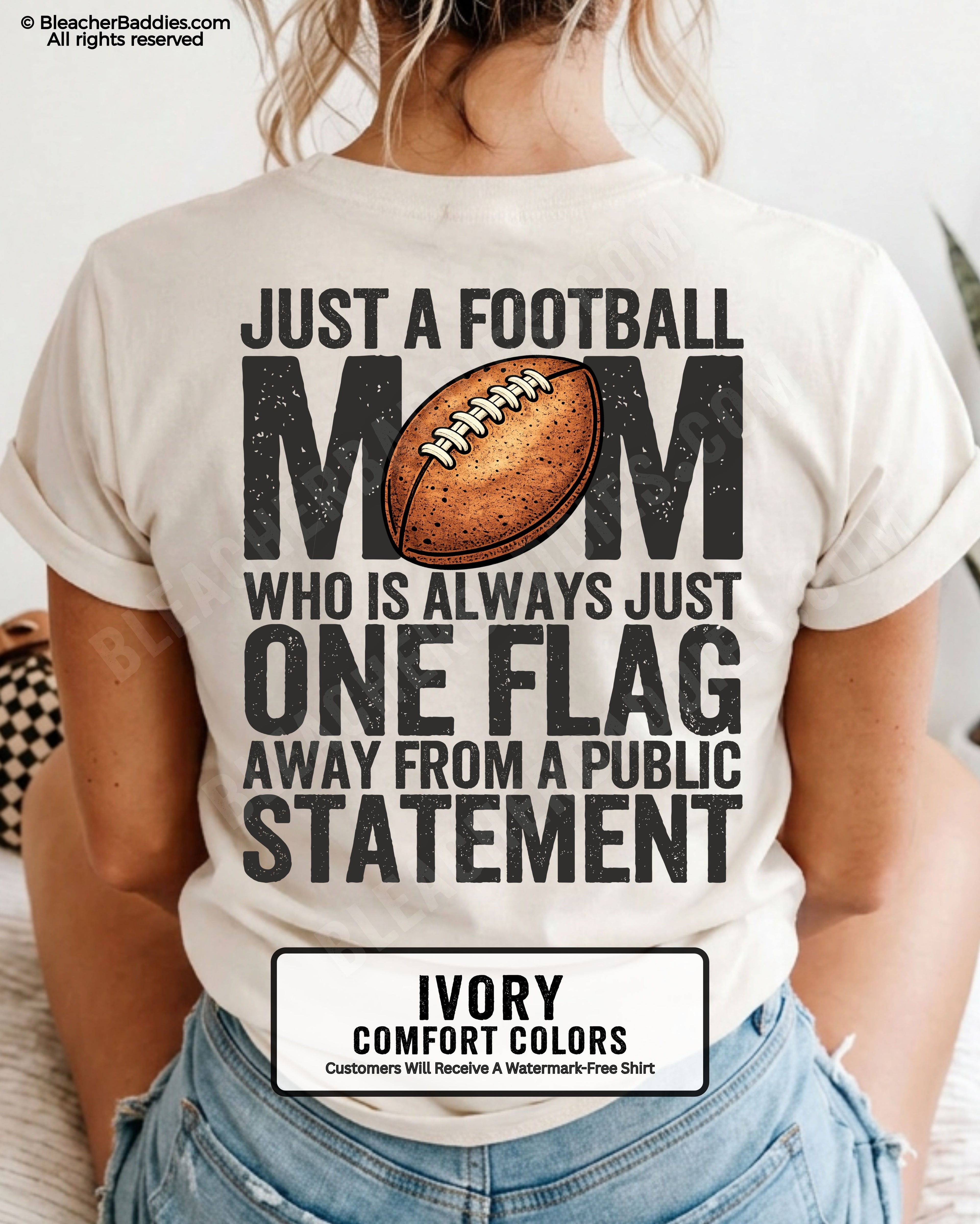 ivory comfort colors football mom game day shirt worn by model with back graphic that says just a football mom who is always just one flag away from a public statement