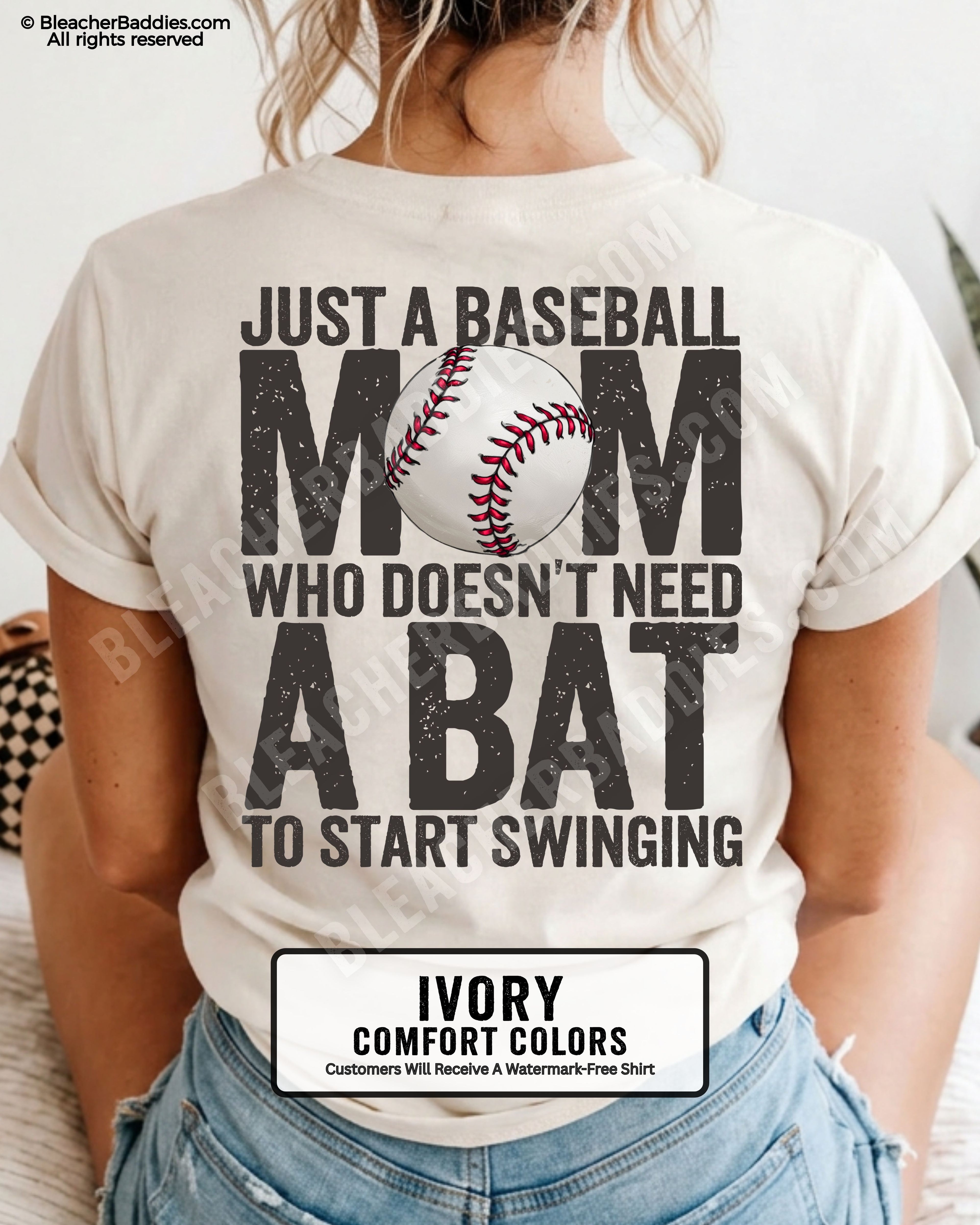 Ivory Comfort Colors game day shirt worn by woman showing distressed back graphic reading “Just a Baseball Mom Who Doesn’t Need A Bat To Start Swinging” with baseball illustration layered over MOM text
