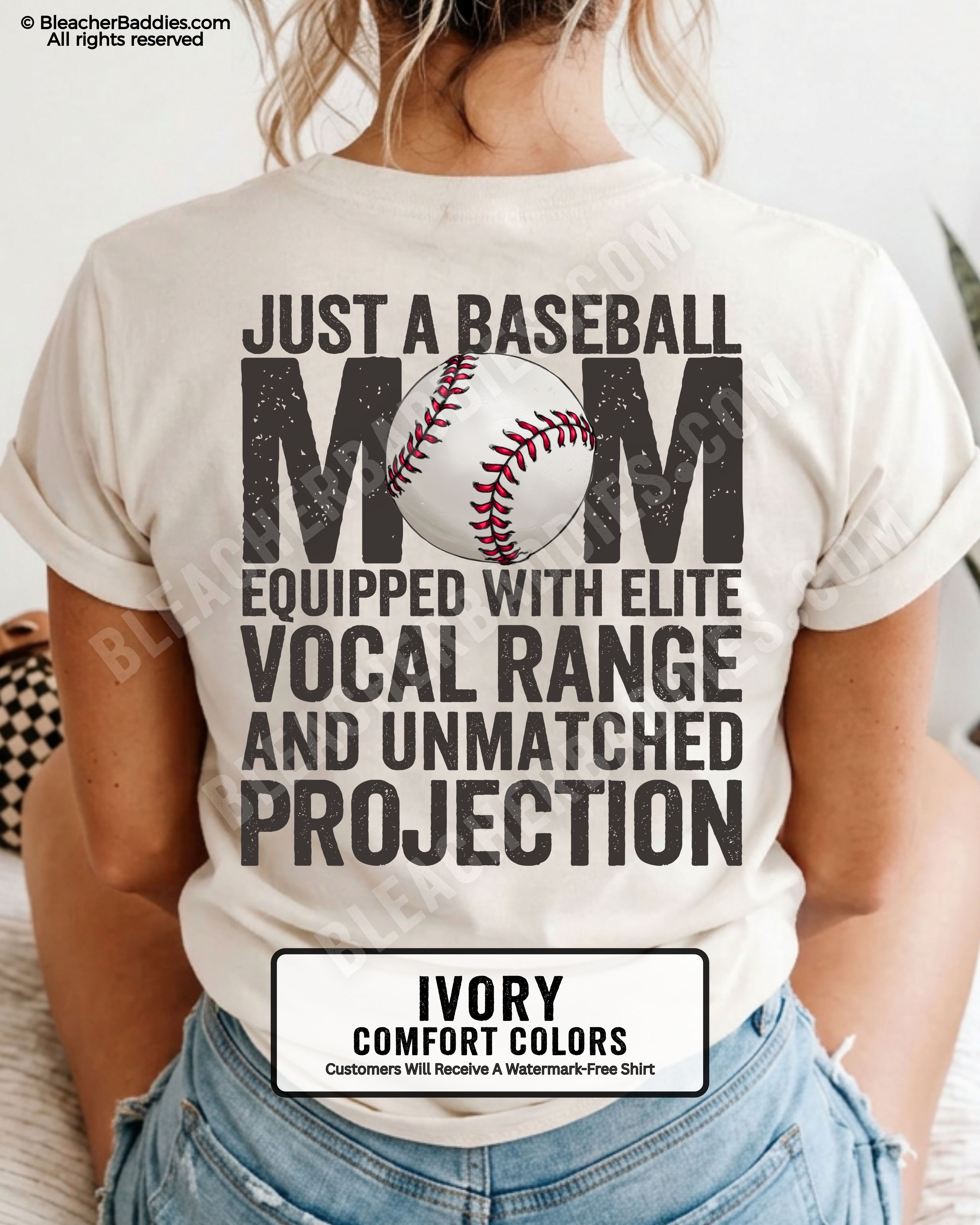 Ivory Comfort Colors game day shirt worn by woman showing distressed back graphic reading “Just a Baseball Mom Equipped With Elite Vocal Range and Unmatched Projection” with baseball illustration over MOM text