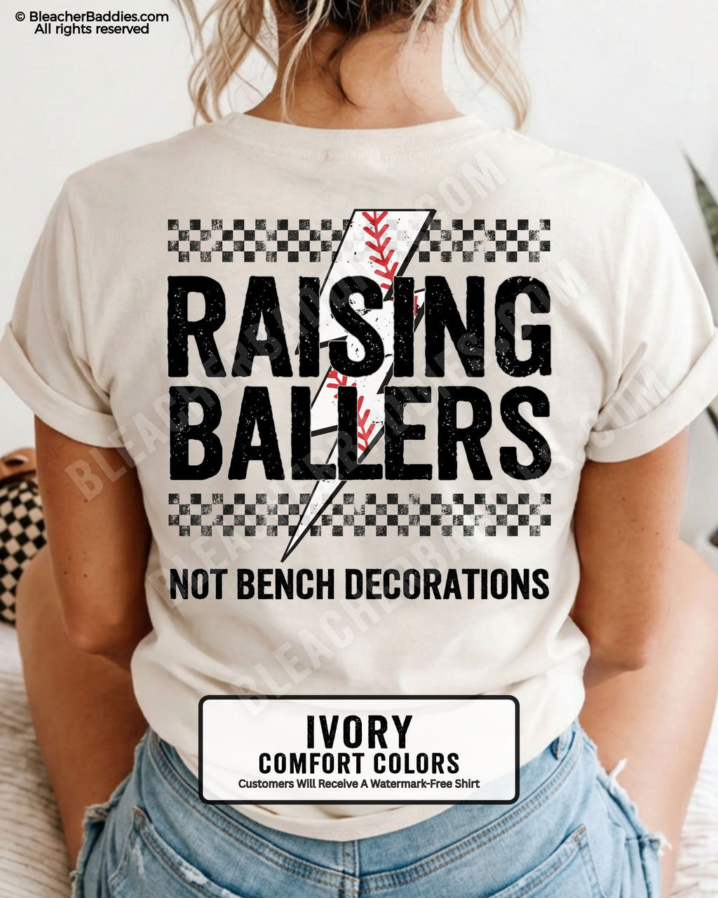 Ivory Comfort Colors shirt with distressed Raising Ballers baseball graphic featuring checkerboard stripes, red baseball stitching, and “Not Bench Decorations” slogan across the back.