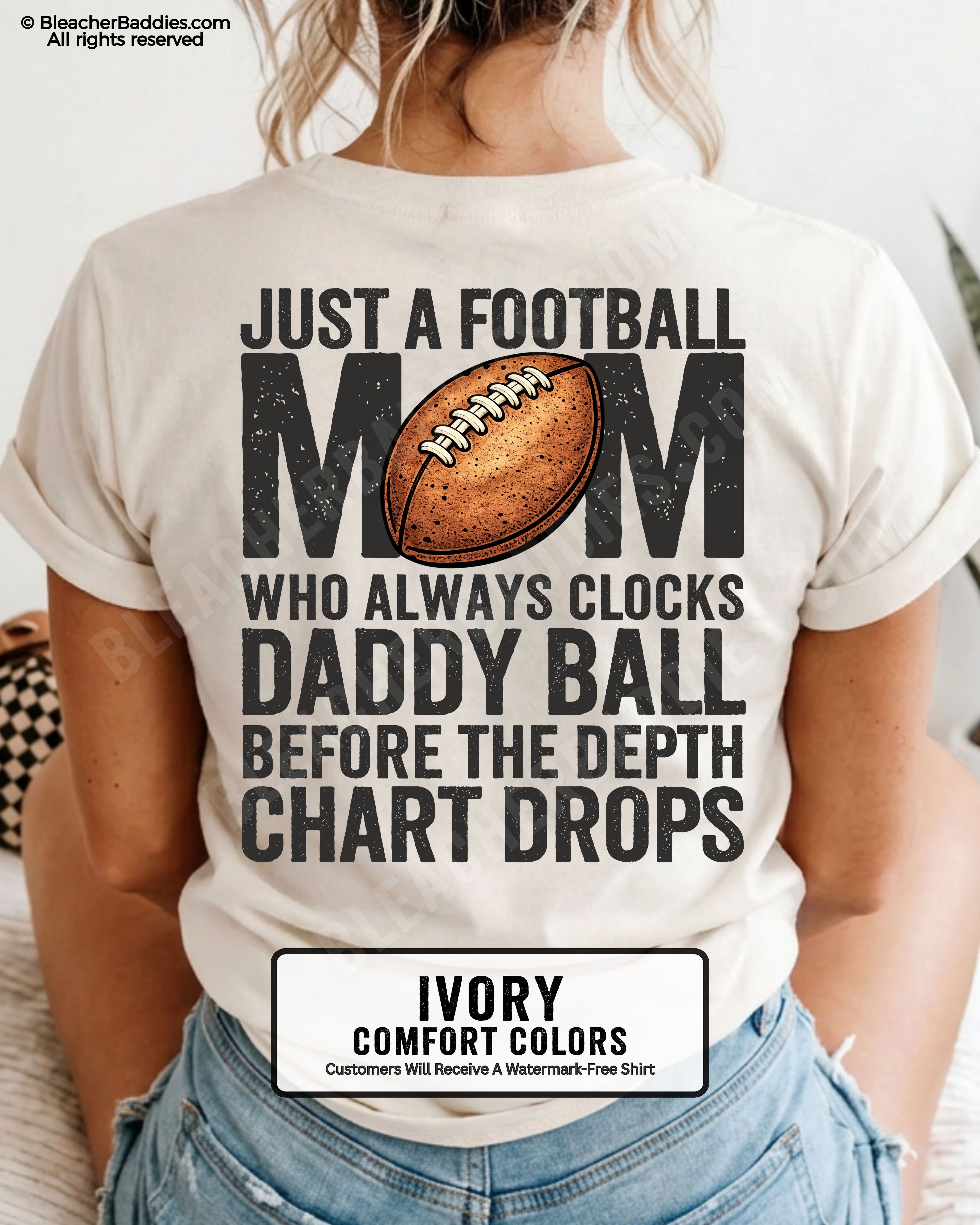 Ivory Comfort Colors t-shirt worn by woman showing back graphic reading “Just a football mom who always clocks daddy ball before the depth chart drops” with football illustration